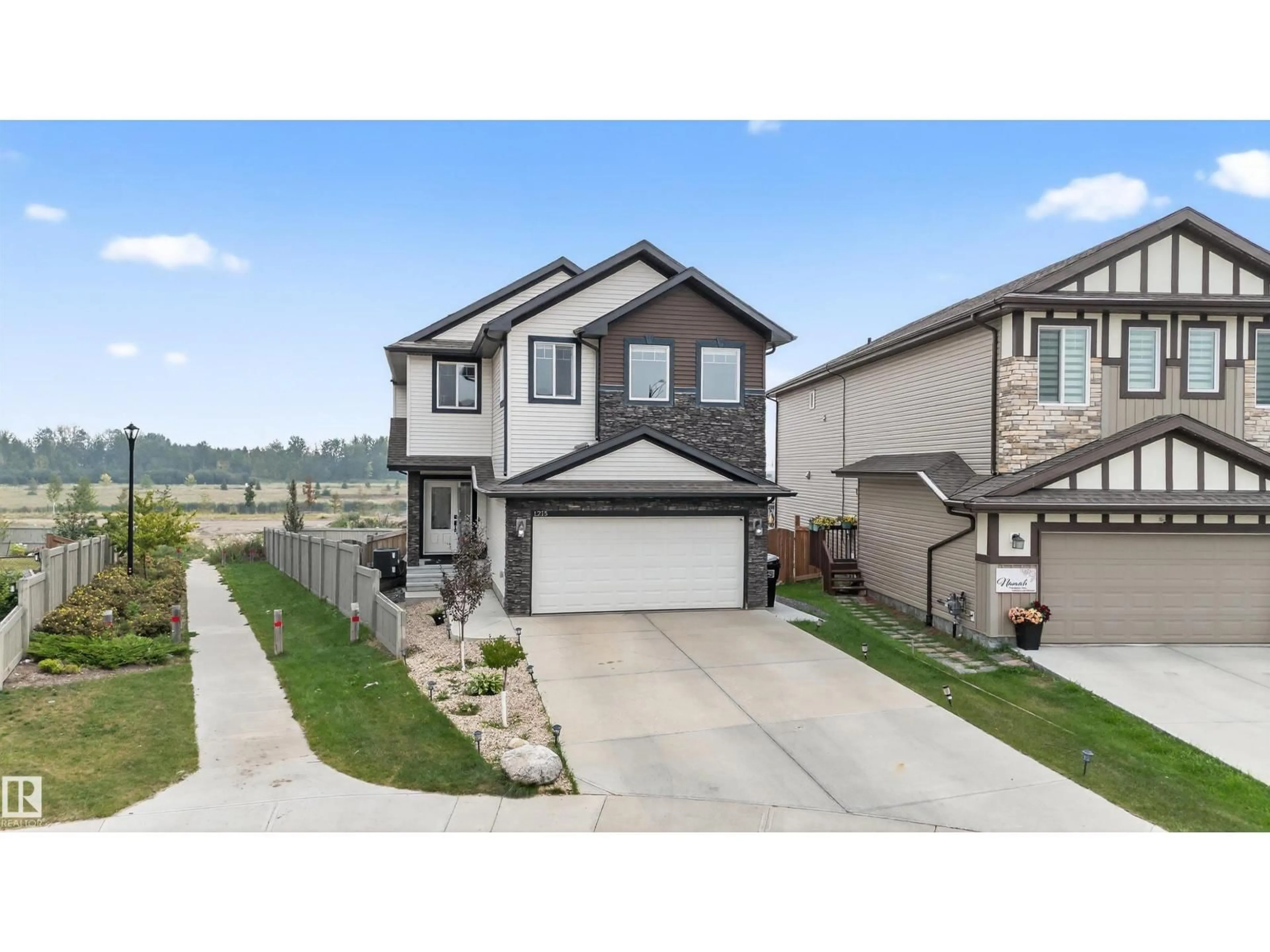 Home with vinyl exterior material, street for 1215 24 AV, Edmonton Alberta T6T2E4