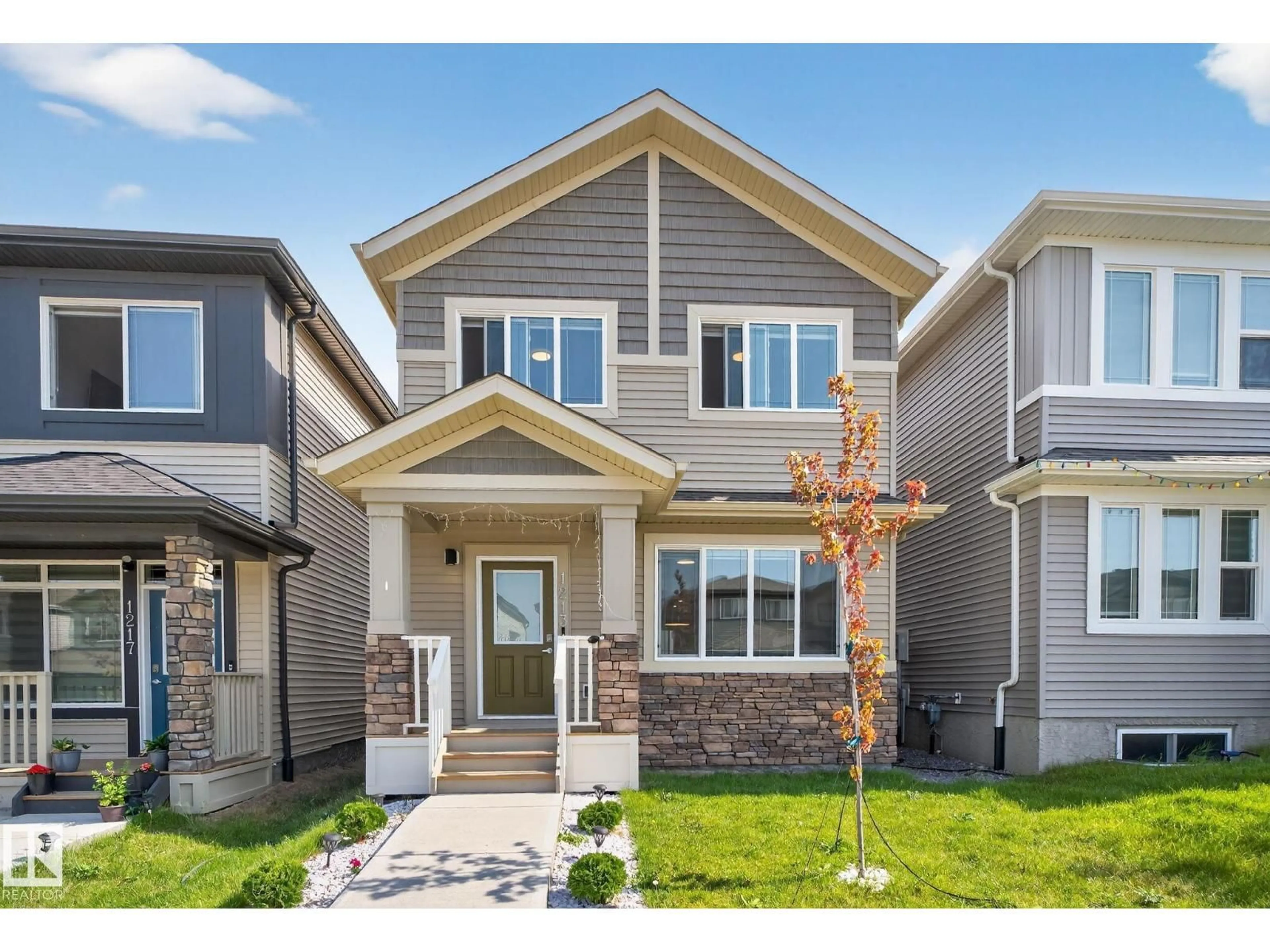 Home with vinyl exterior material, street for 1213 16A ST, Edmonton Alberta T6T2S5