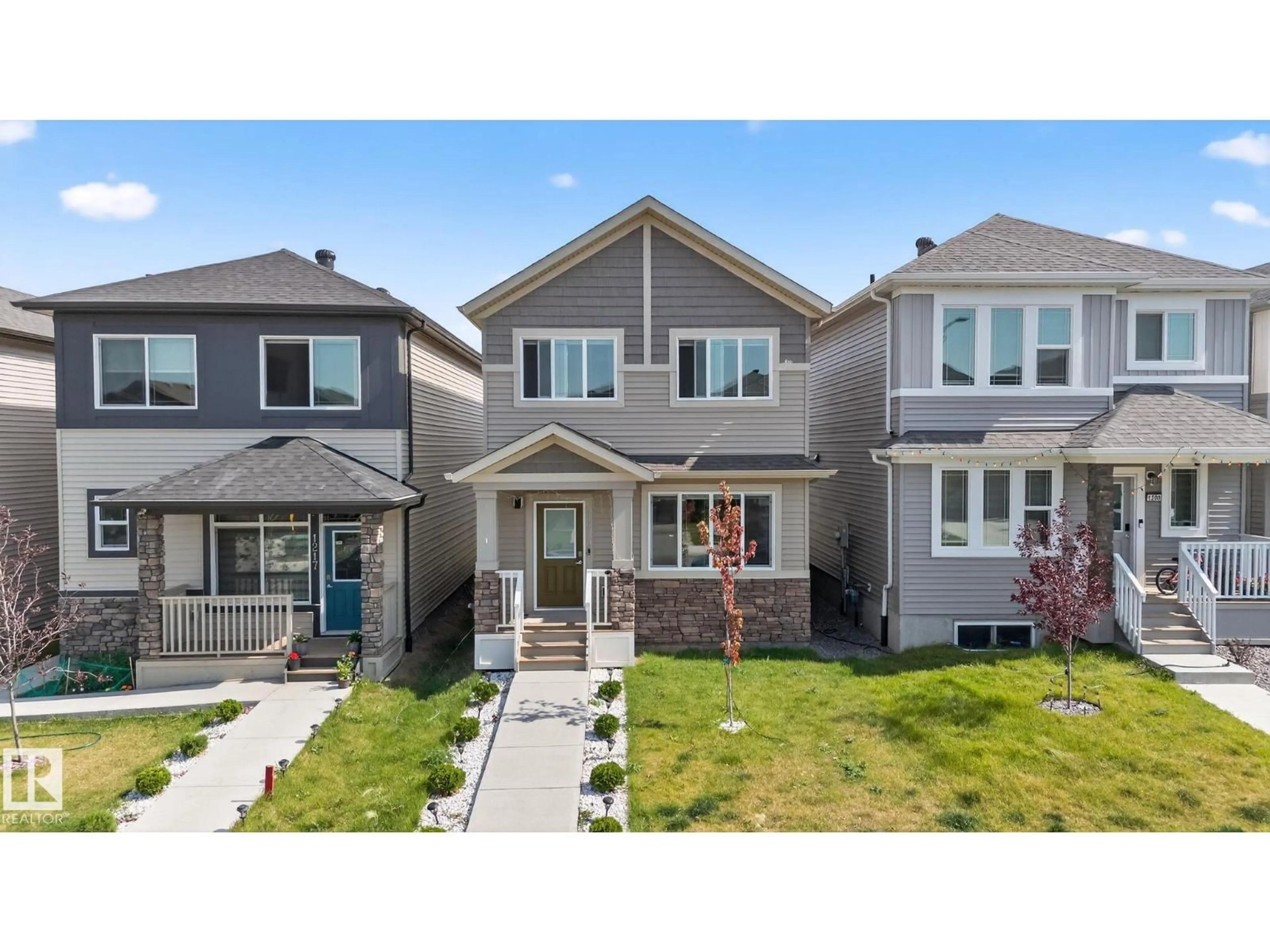 Home with vinyl exterior material, street for 1213 16A ST, Edmonton Alberta T6T2S5