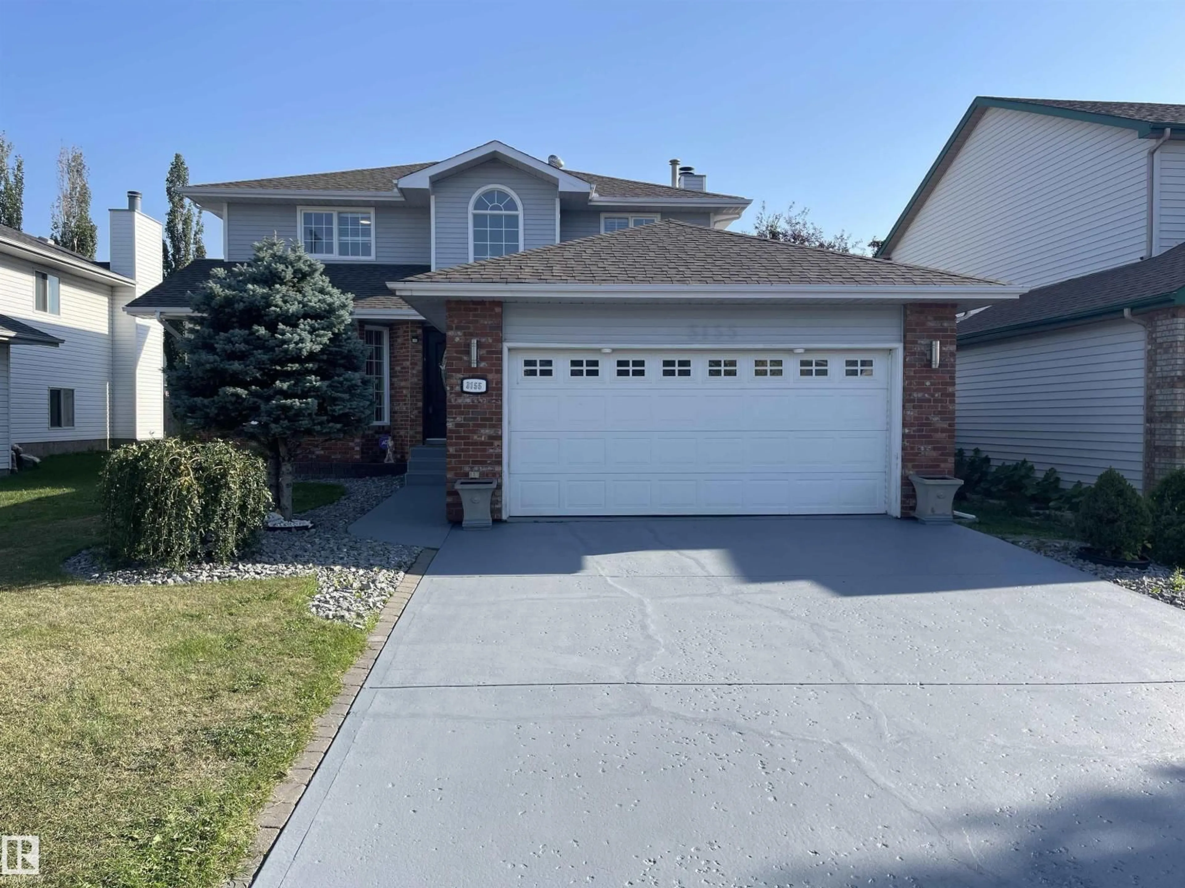 Home with vinyl exterior material, street for 3155 36 AV, Edmonton Alberta T6T1H8