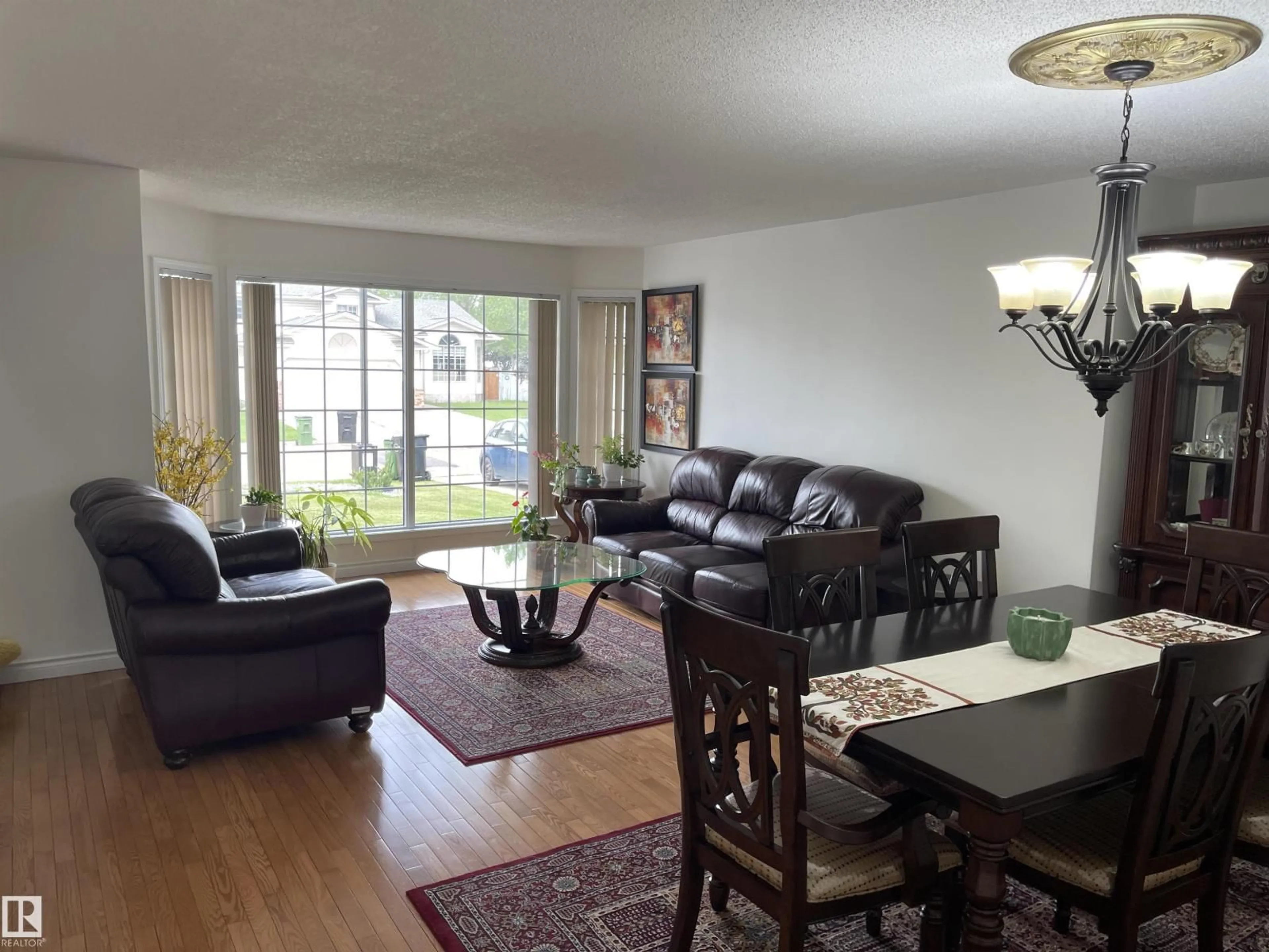 Living room with furniture, wood/laminate floor for 3155 36 AV, Edmonton Alberta T6T1H8