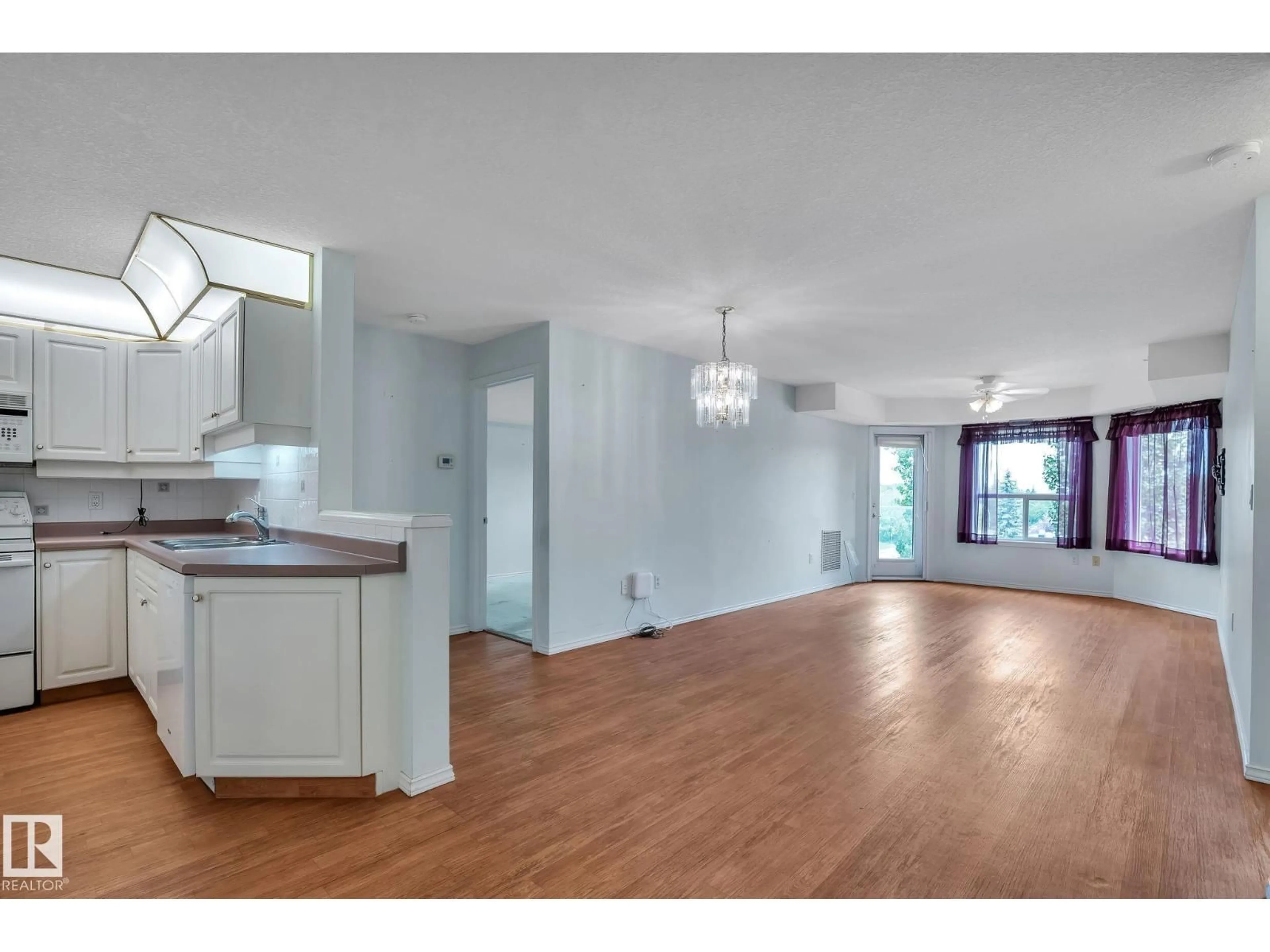 Open concept kitchen, wood/laminate floor for 407 - 6703 172 ST, Edmonton Alberta T5T6H9