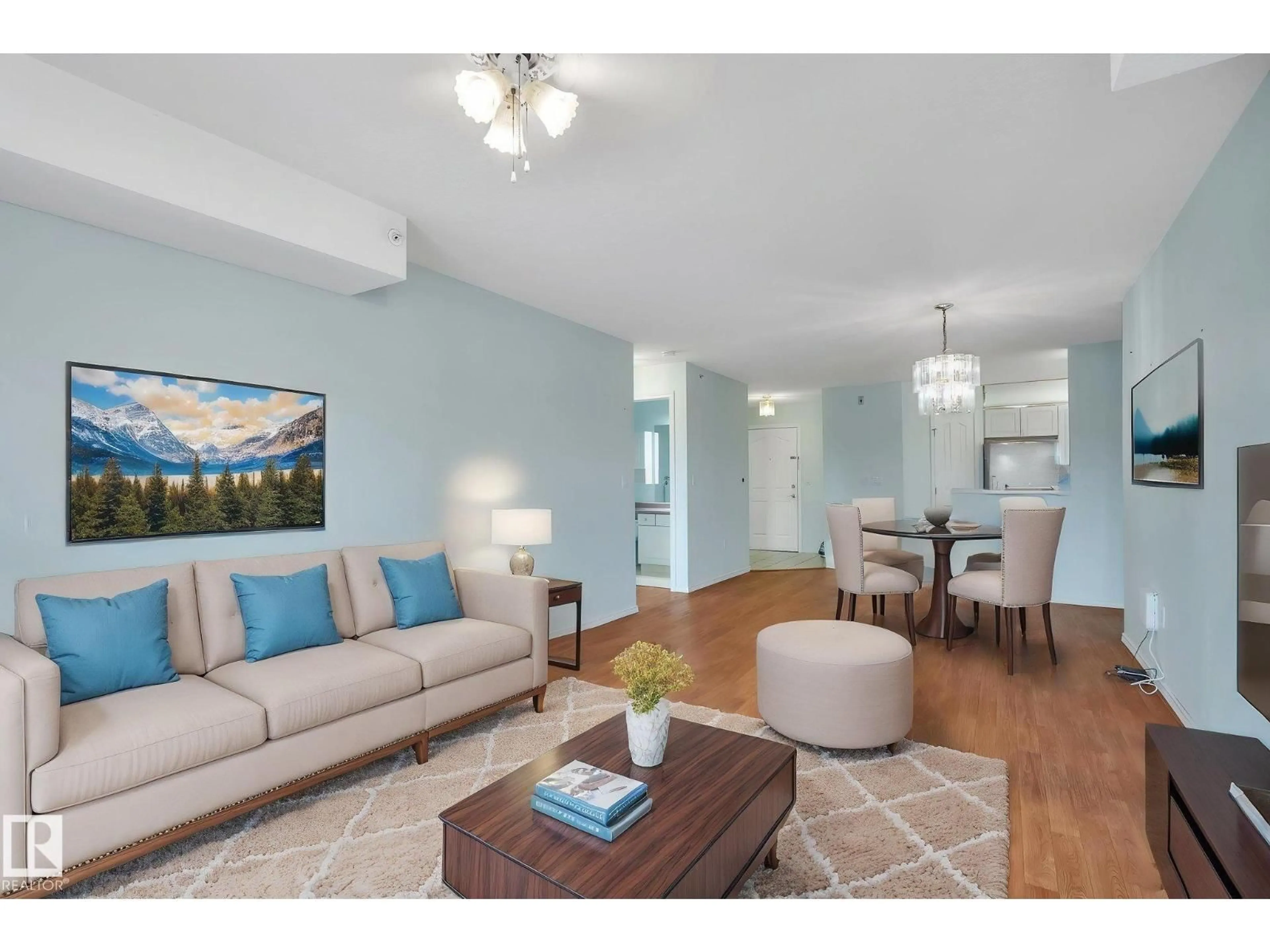 Living room with furniture, wood/laminate floor for 407 - 6703 172 ST, Edmonton Alberta T5T6H9