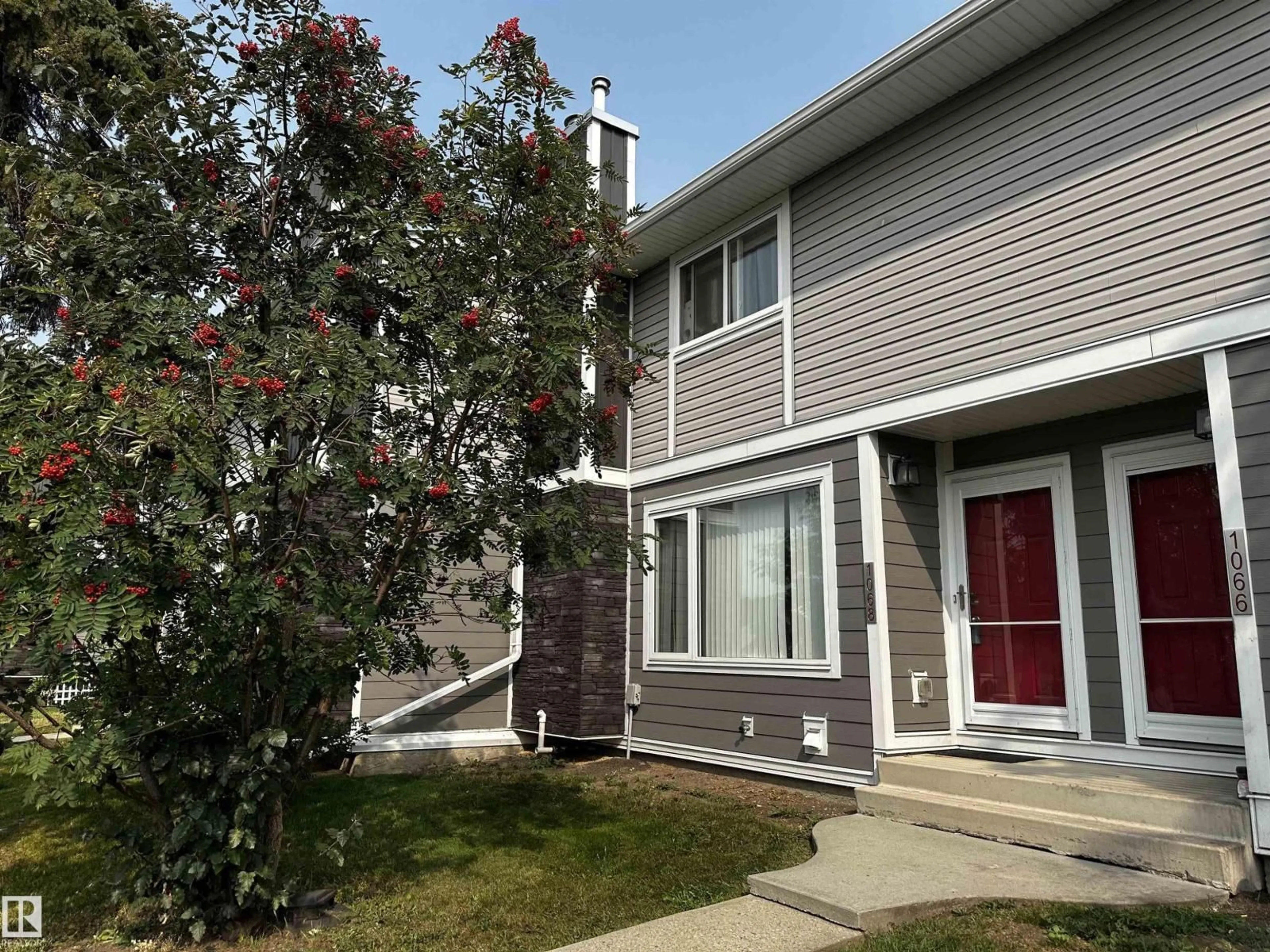 Home with vinyl exterior material, street for 1068 LAKEWOOD RD, Edmonton Alberta T6K3T7