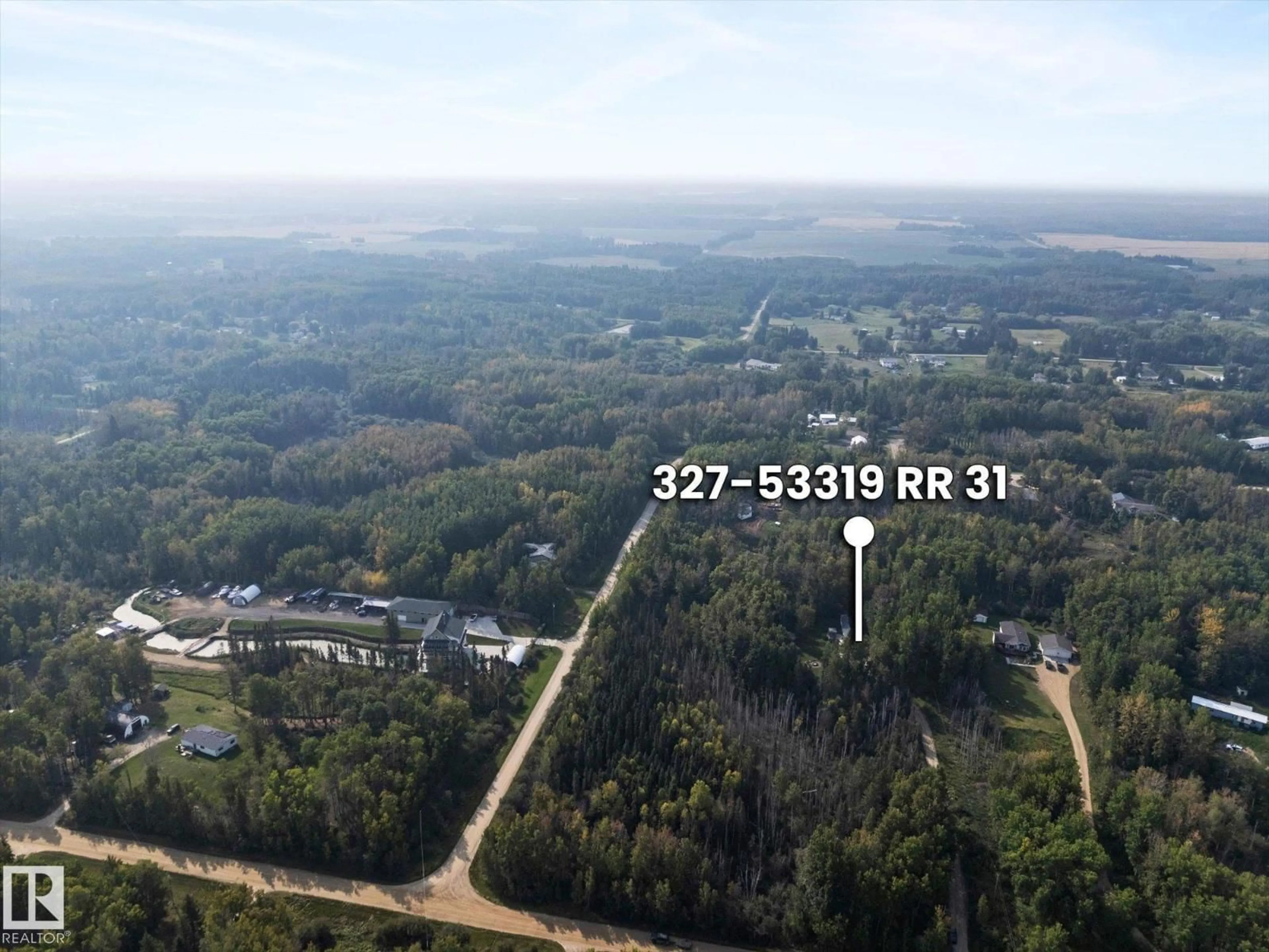 A pic from outside/outdoor area/front of a property/back of a property/a pic from drone, forest/trees view for 53319 - 327 RGE ROAD 31, Rural Parkland County Alberta T7Y0E3