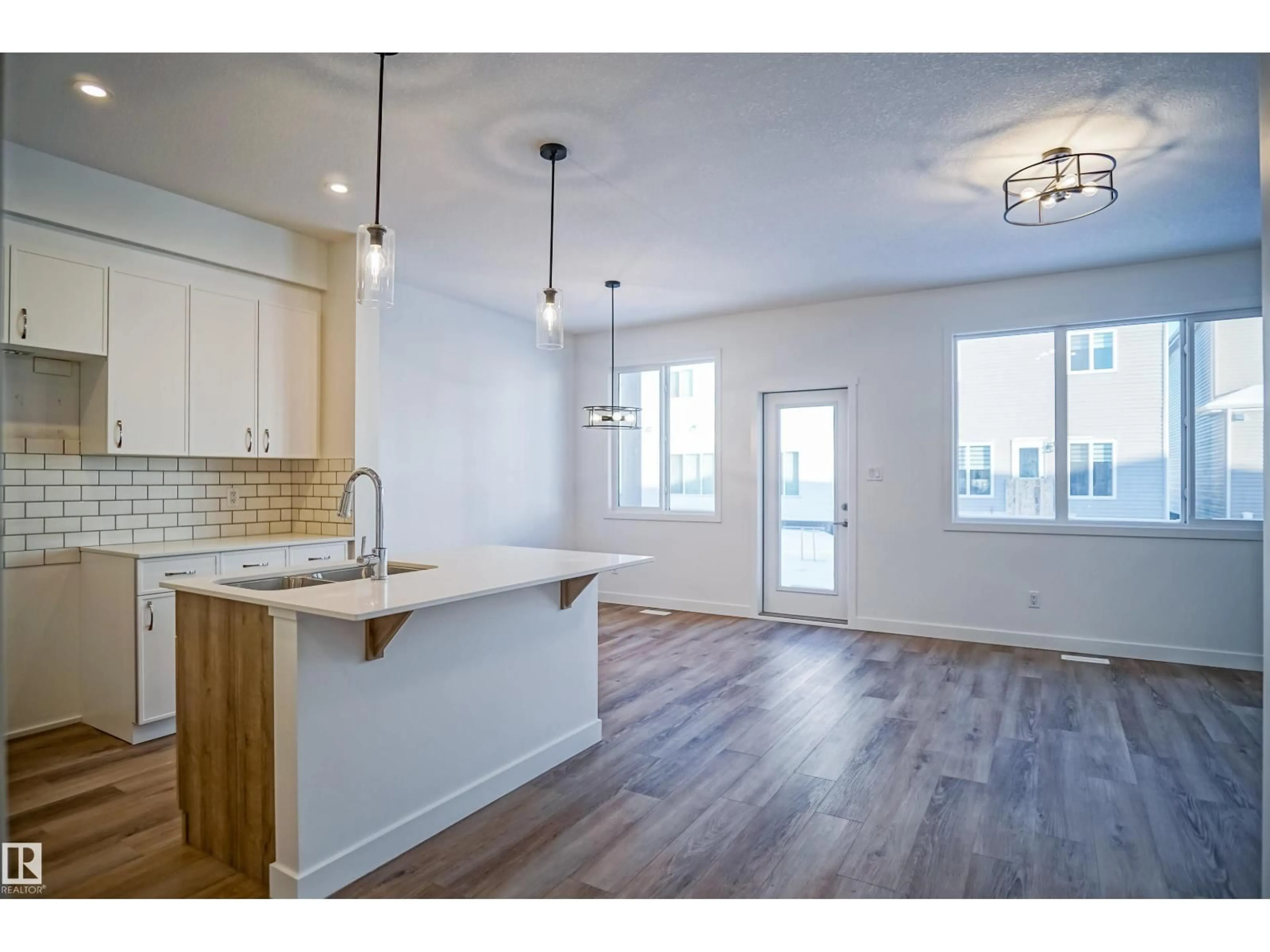 Open concept kitchen, wood/laminate floor for 193 CALEDON CR, Spruce Grove Alberta T7X0Y6