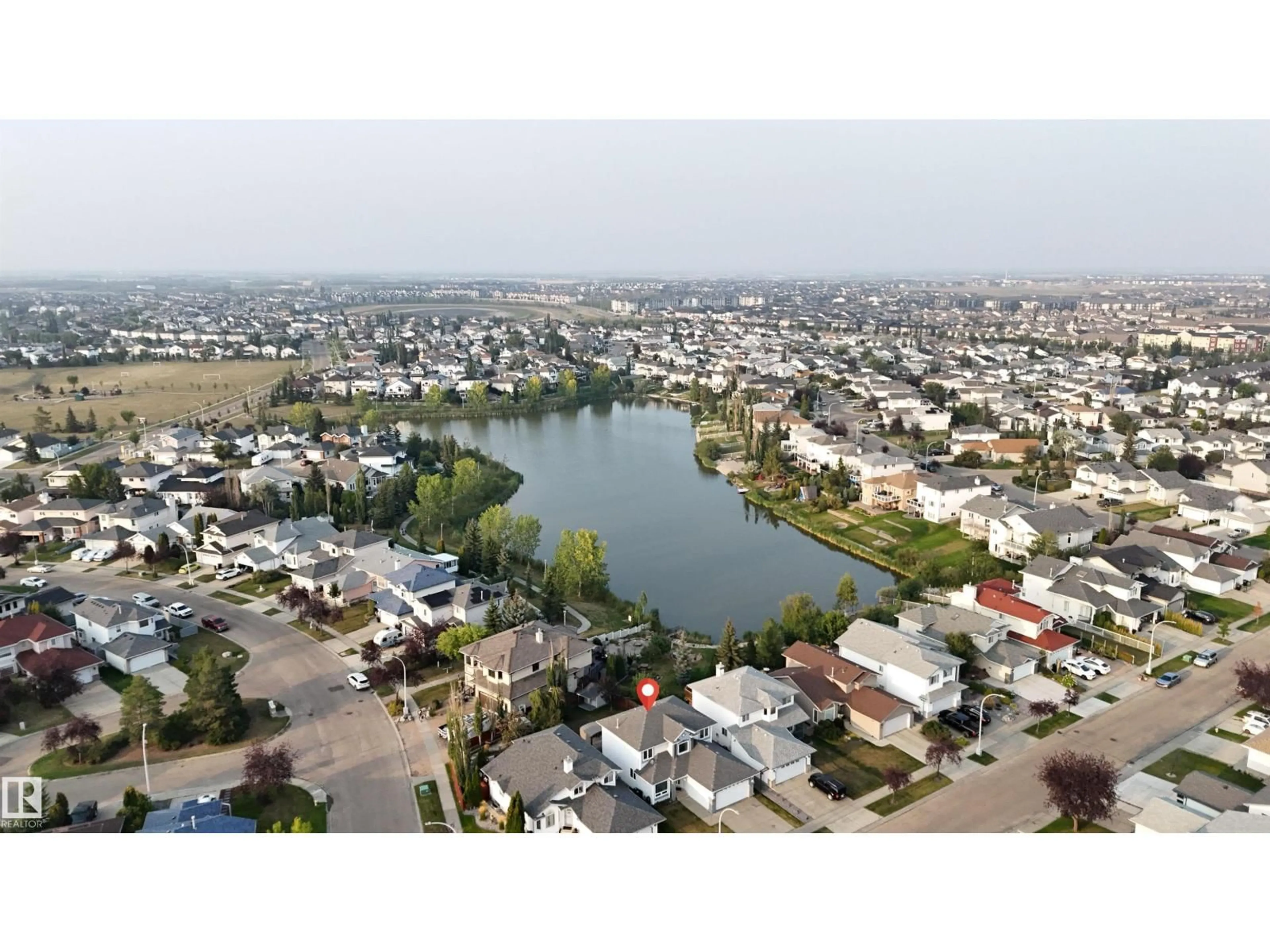 A pic from outside/outdoor area/front of a property/back of a property/a pic from drone, water/lake/river/ocean view for 442 KLARVATTEN LAKE WD, Edmonton Alberta T5Z3B9