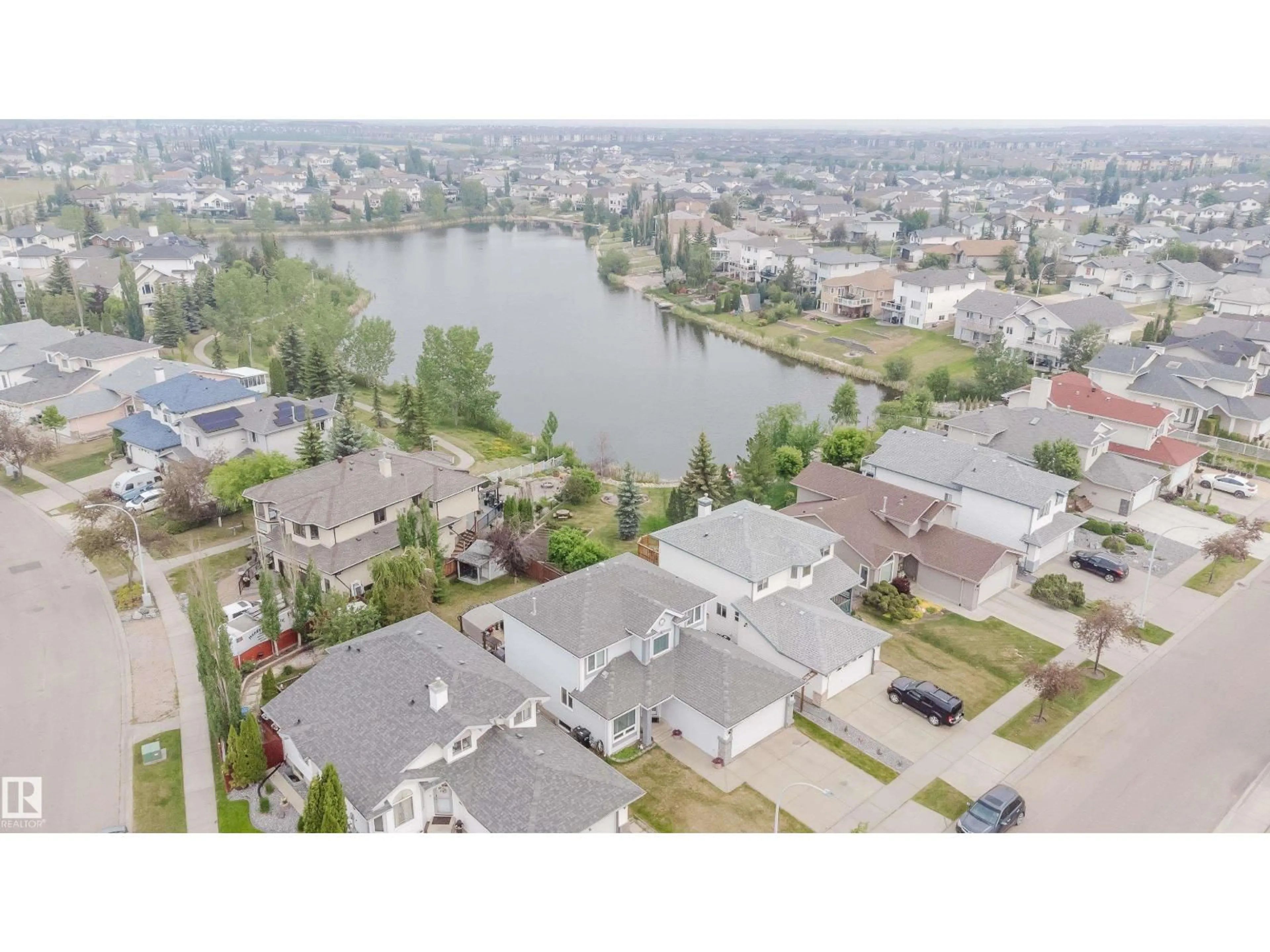 A pic from outside/outdoor area/front of a property/back of a property/a pic from drone, water/lake/river/ocean view for 442 KLARVATTEN LAKE WD, Edmonton Alberta T5Z3B9
