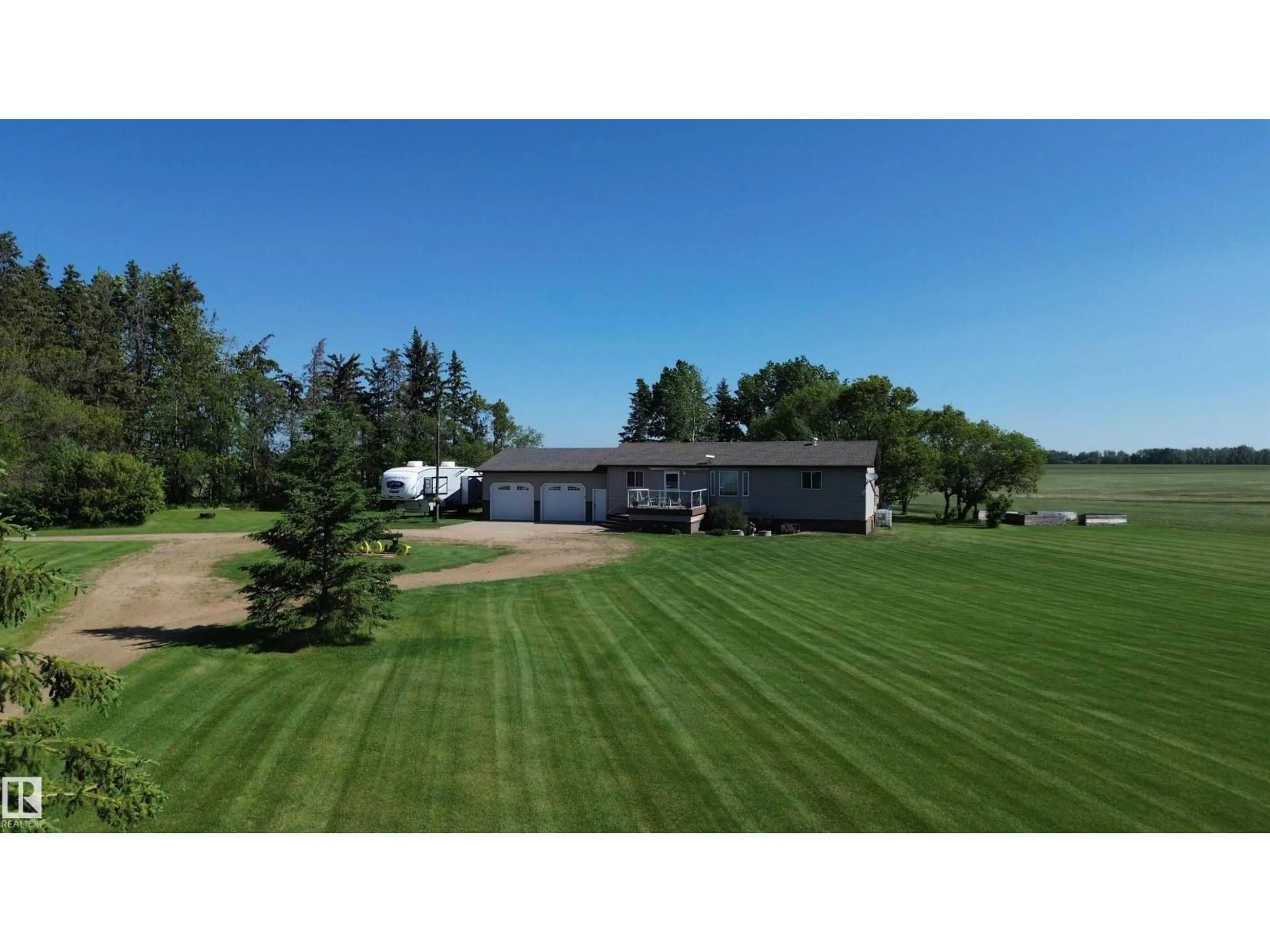 A pic from outside/outdoor area/front of a property/back of a property/a pic from drone, mountain view for 61101 RGE RD 261, Rural Westlock County Alberta T7P2P4