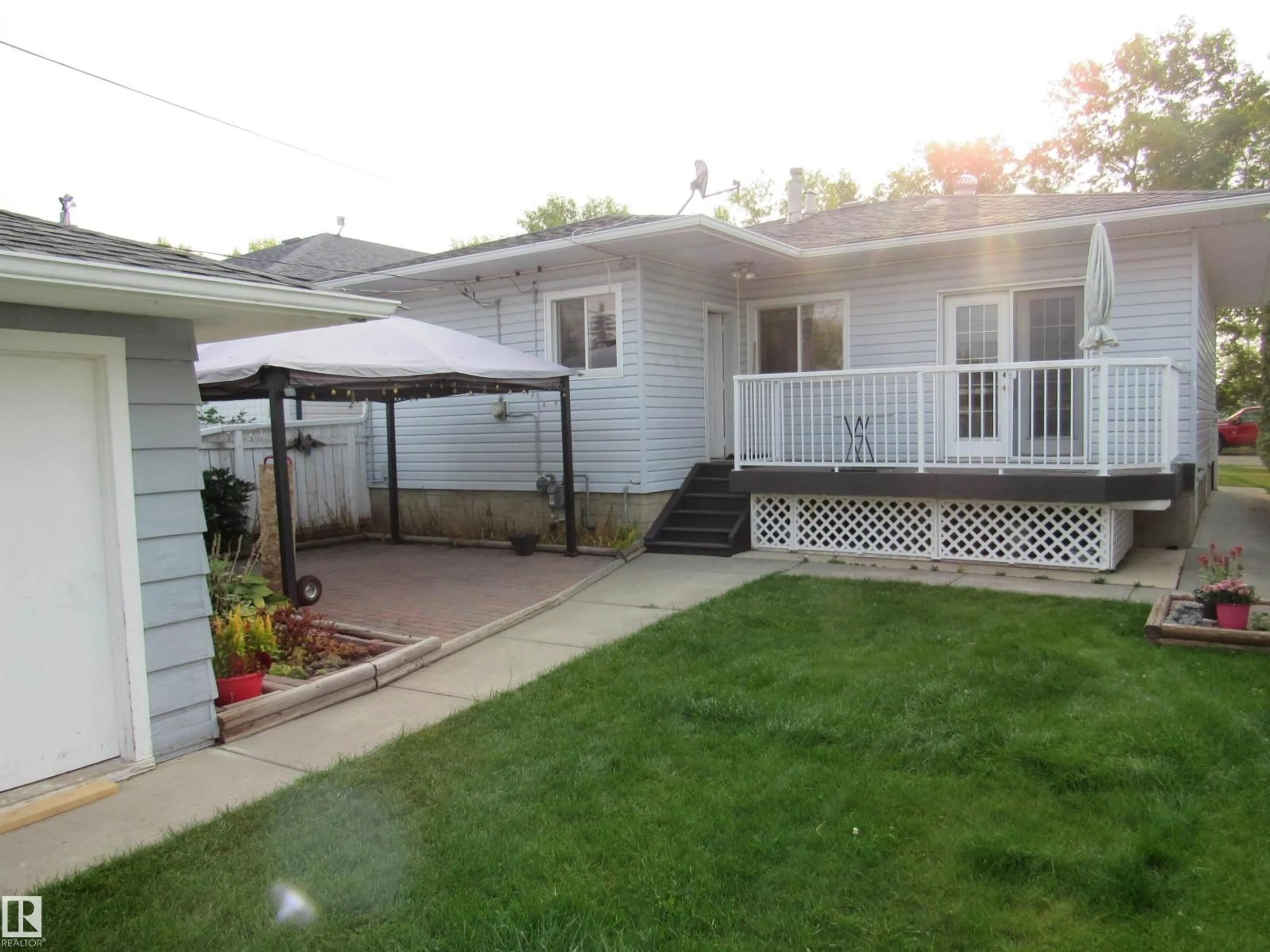 Home with vinyl exterior material, street for 5110 52ND STREET, Barrhead Alberta T7N1G1
