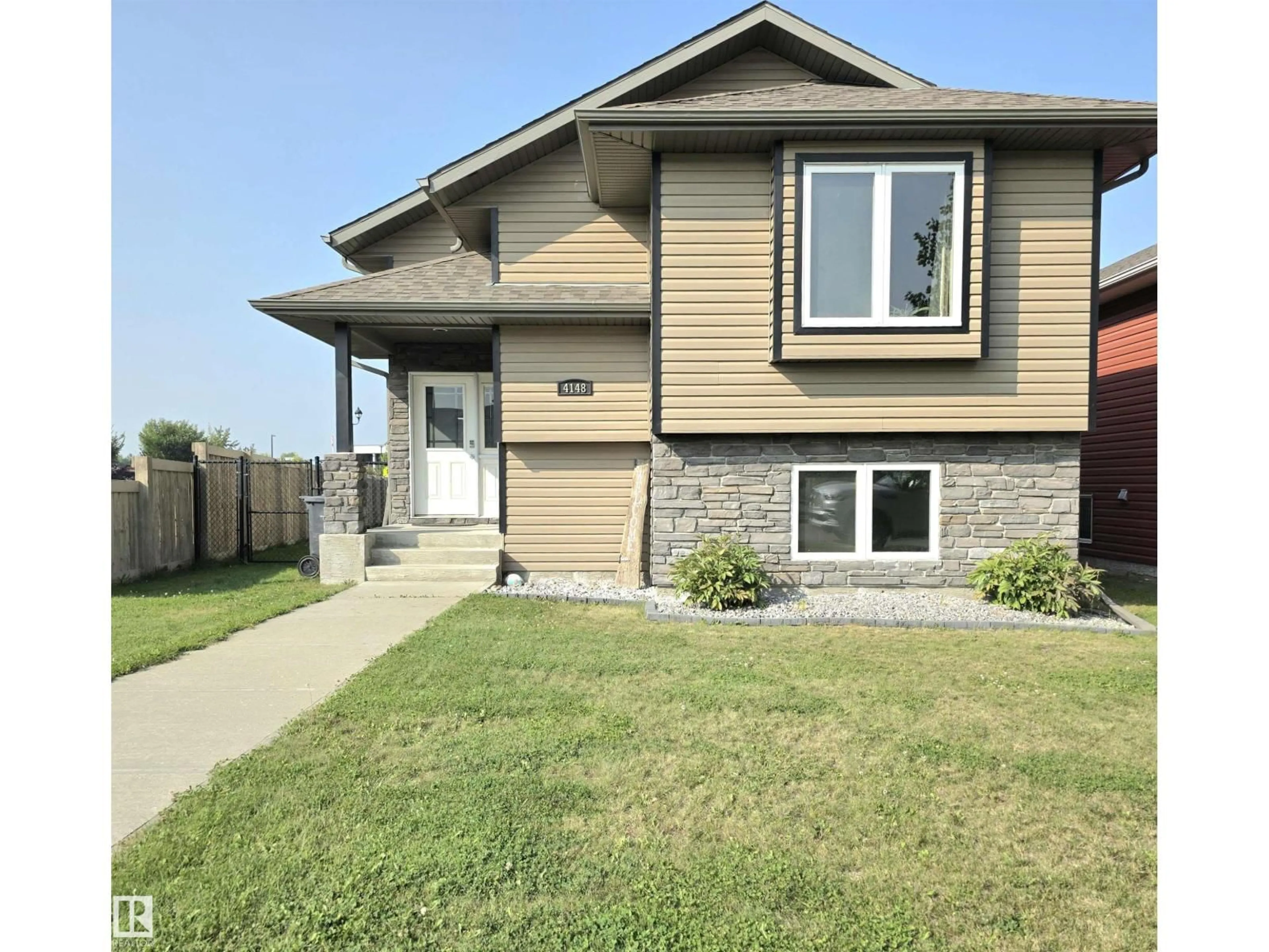 Home with vinyl exterior material, street for 4148 41A AV, Drayton Valley Alberta T7A0B4