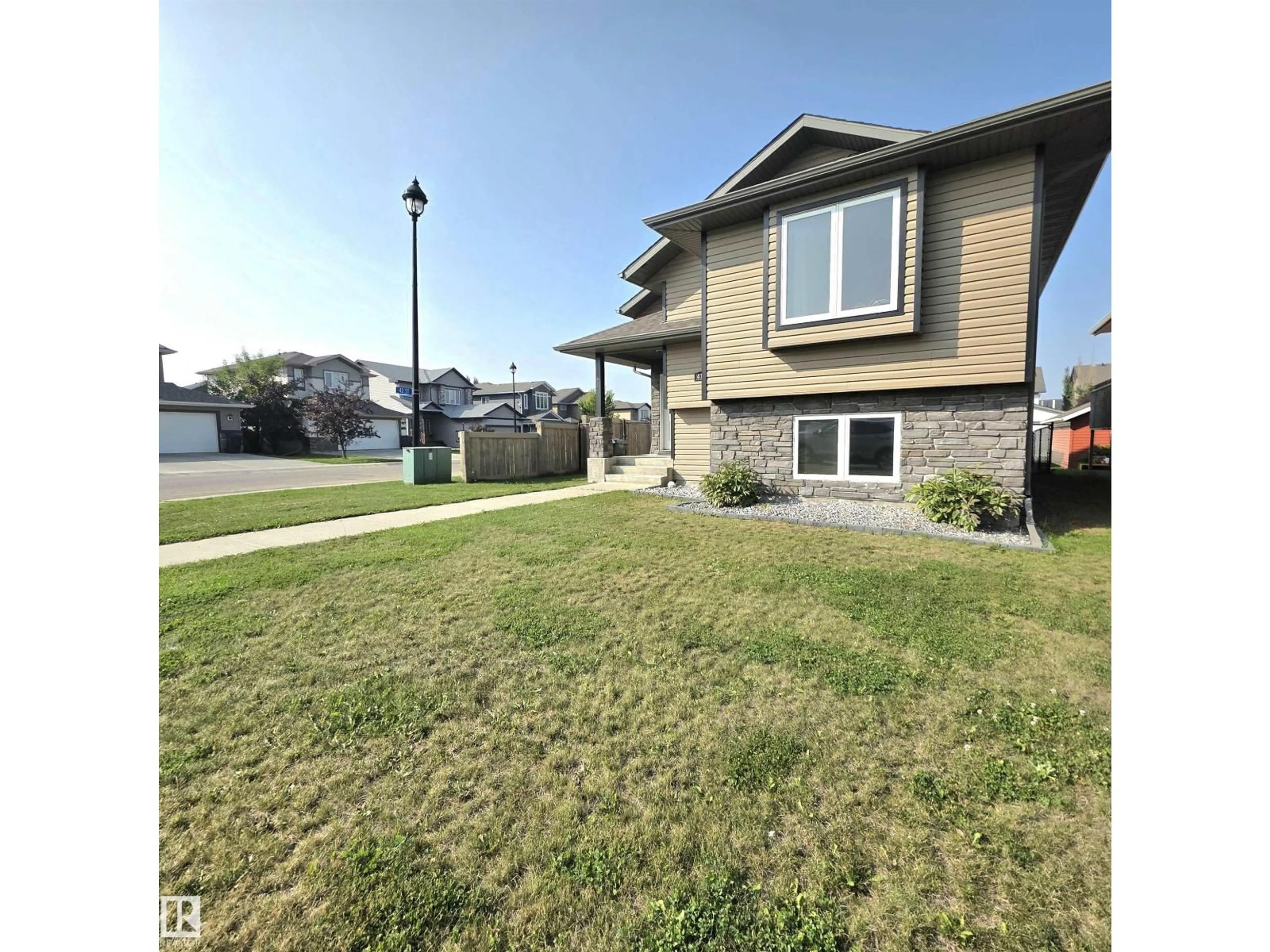 Home with vinyl exterior material, street for 4148 41A AV, Drayton Valley Alberta T7A0B4
