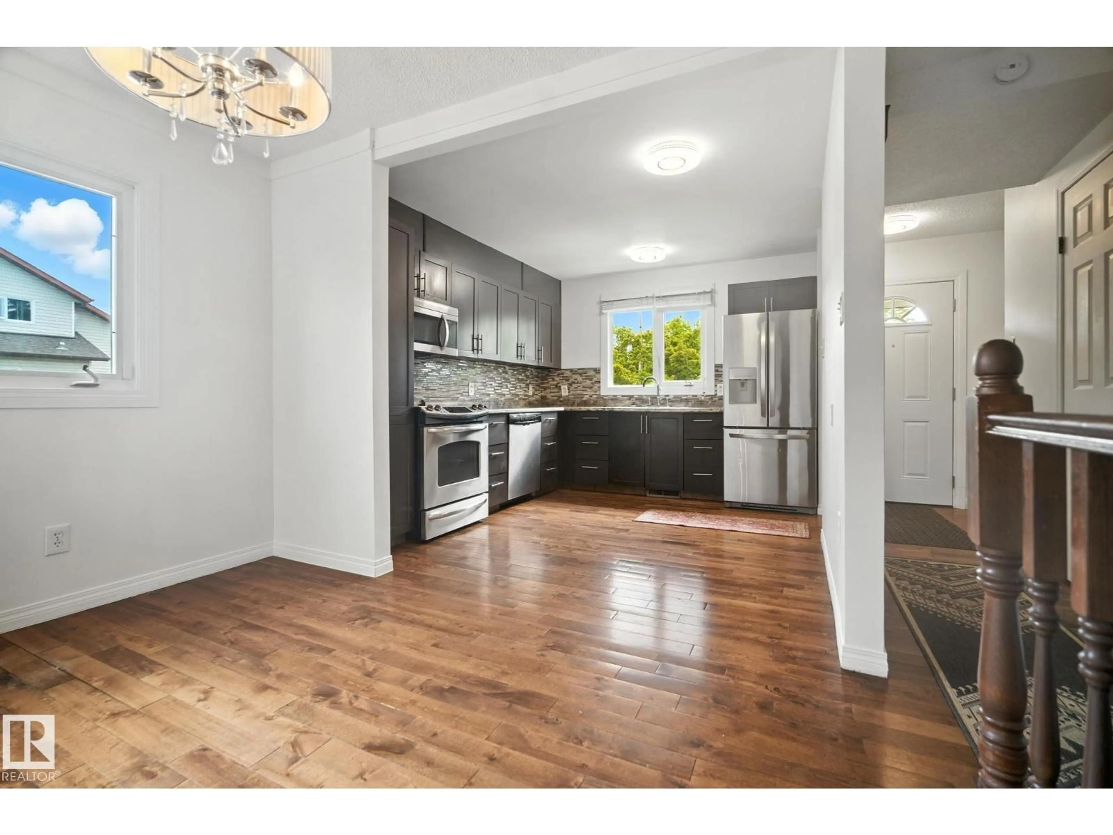 Open concept kitchen, unknown for NW - 9541 A 180 ST, Edmonton Alberta T5T2Z4