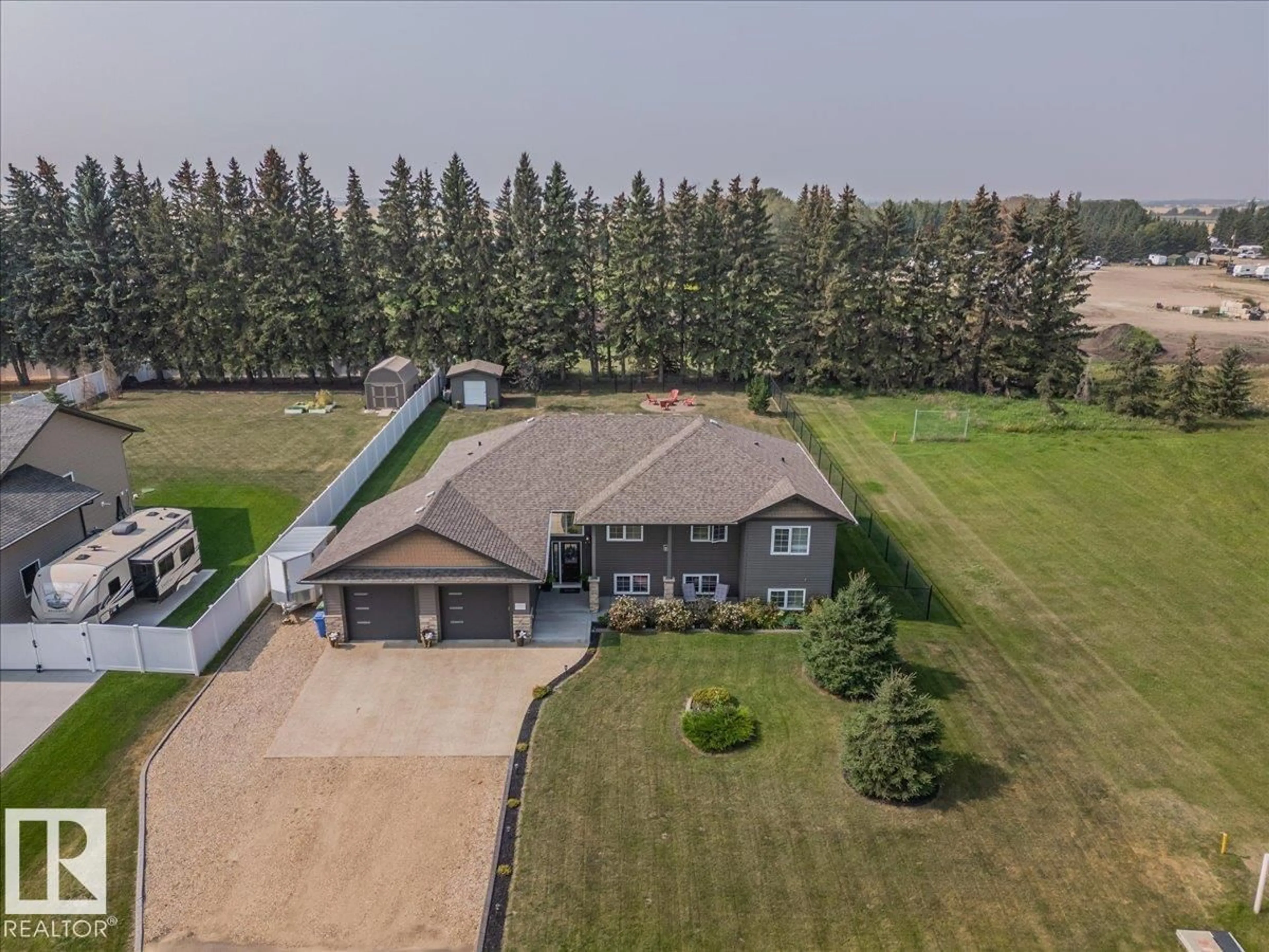 A pic from outside/outdoor area/front of a property/back of a property/a pic from drone, water/lake/river/ocean view for 4814 62 ST, Wetaskiwin Alberta T9A1X9