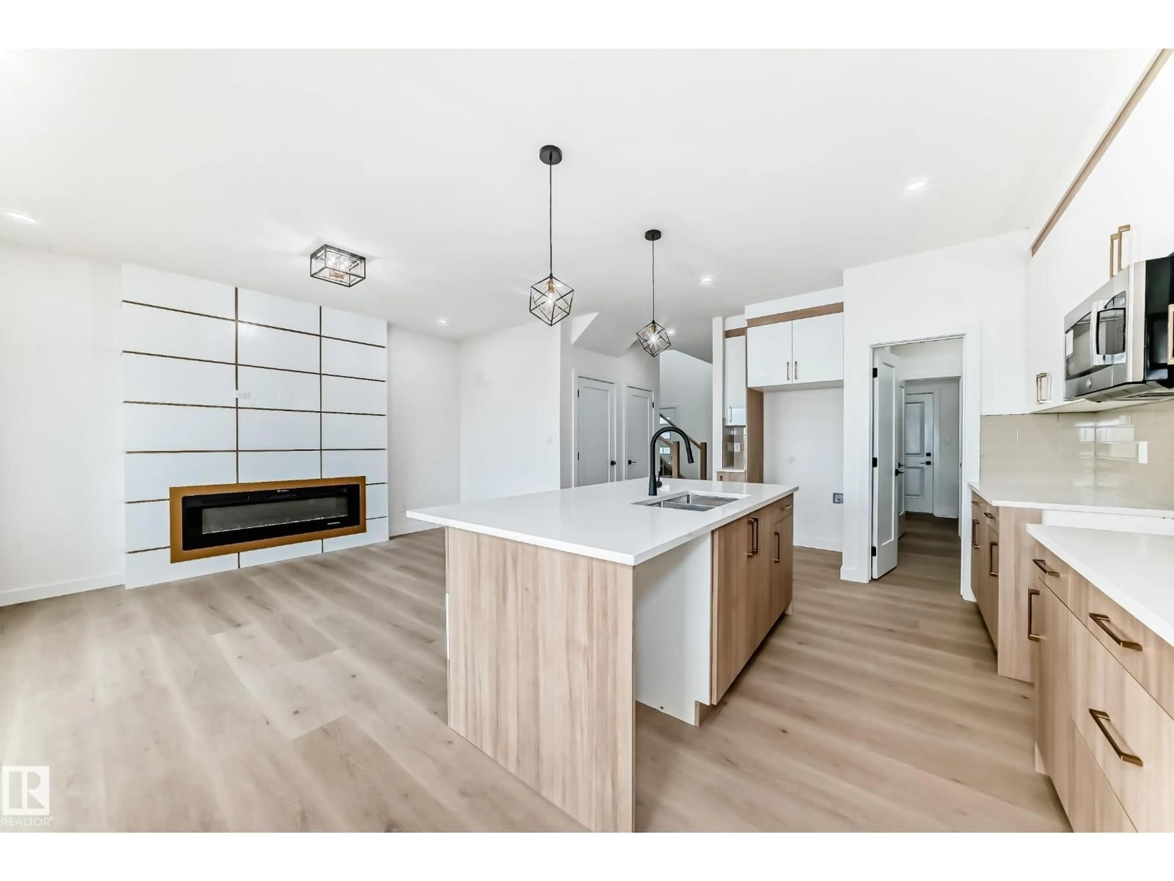 Open concept kitchen, wood/laminate floor for 3718 67 ST, Beaumont Alberta T4X0G6