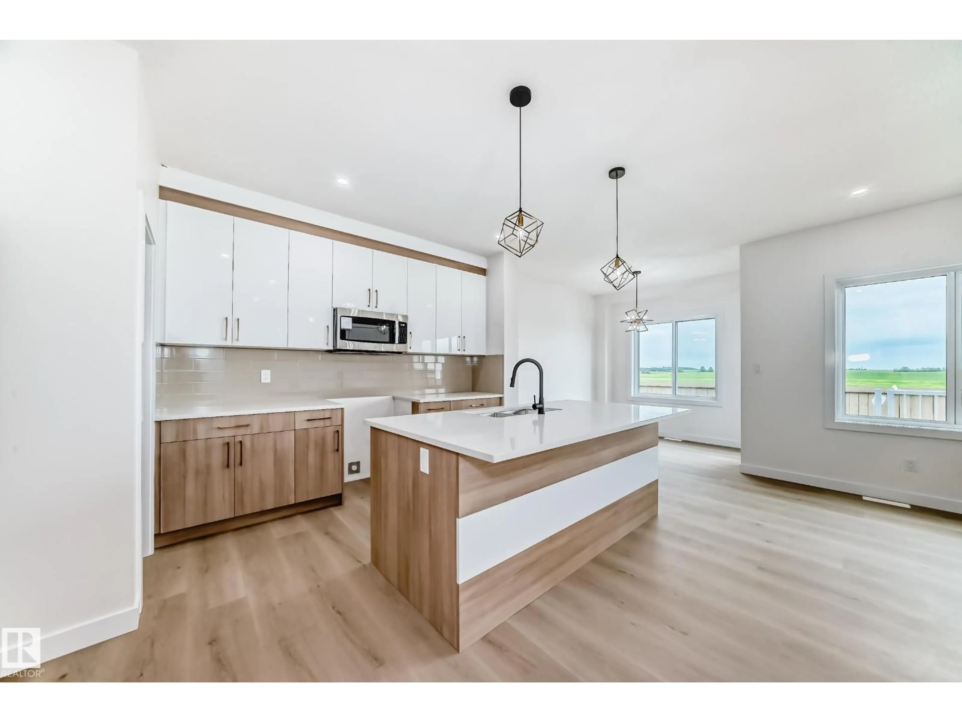 Open concept kitchen, wood/laminate floor for 3718 67 ST, Beaumont Alberta T4X0G6