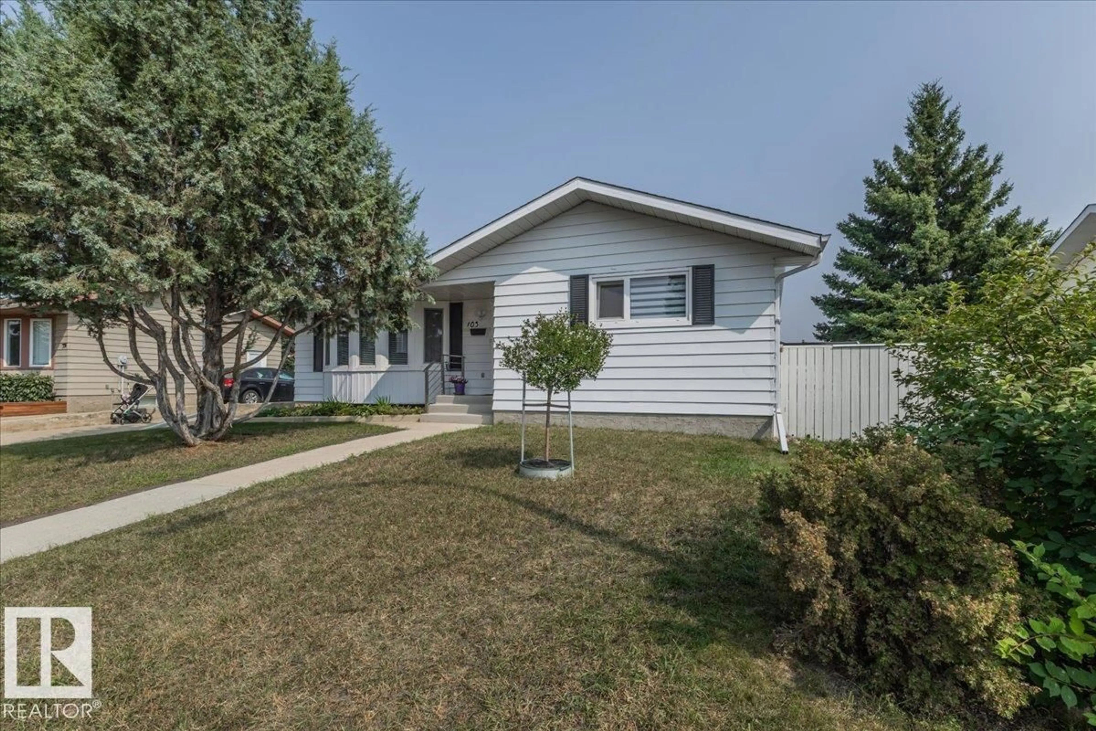 Home with vinyl exterior material, street for 103 PINE DR, Wetaskiwin Alberta T9A2V8