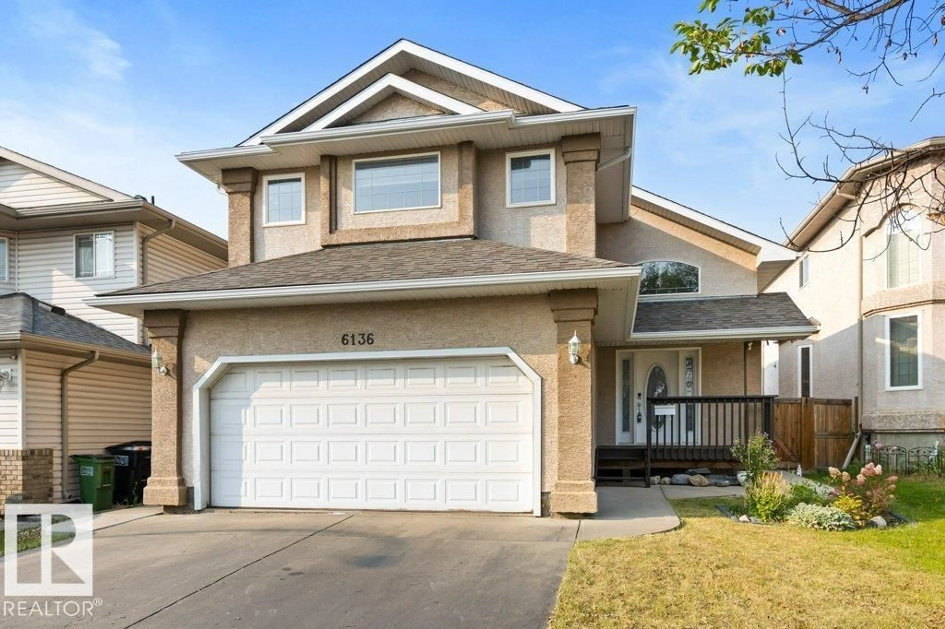 Home with vinyl exterior material, street for NW - 6136 165 AV, Edmonton Alberta T5Y3L5