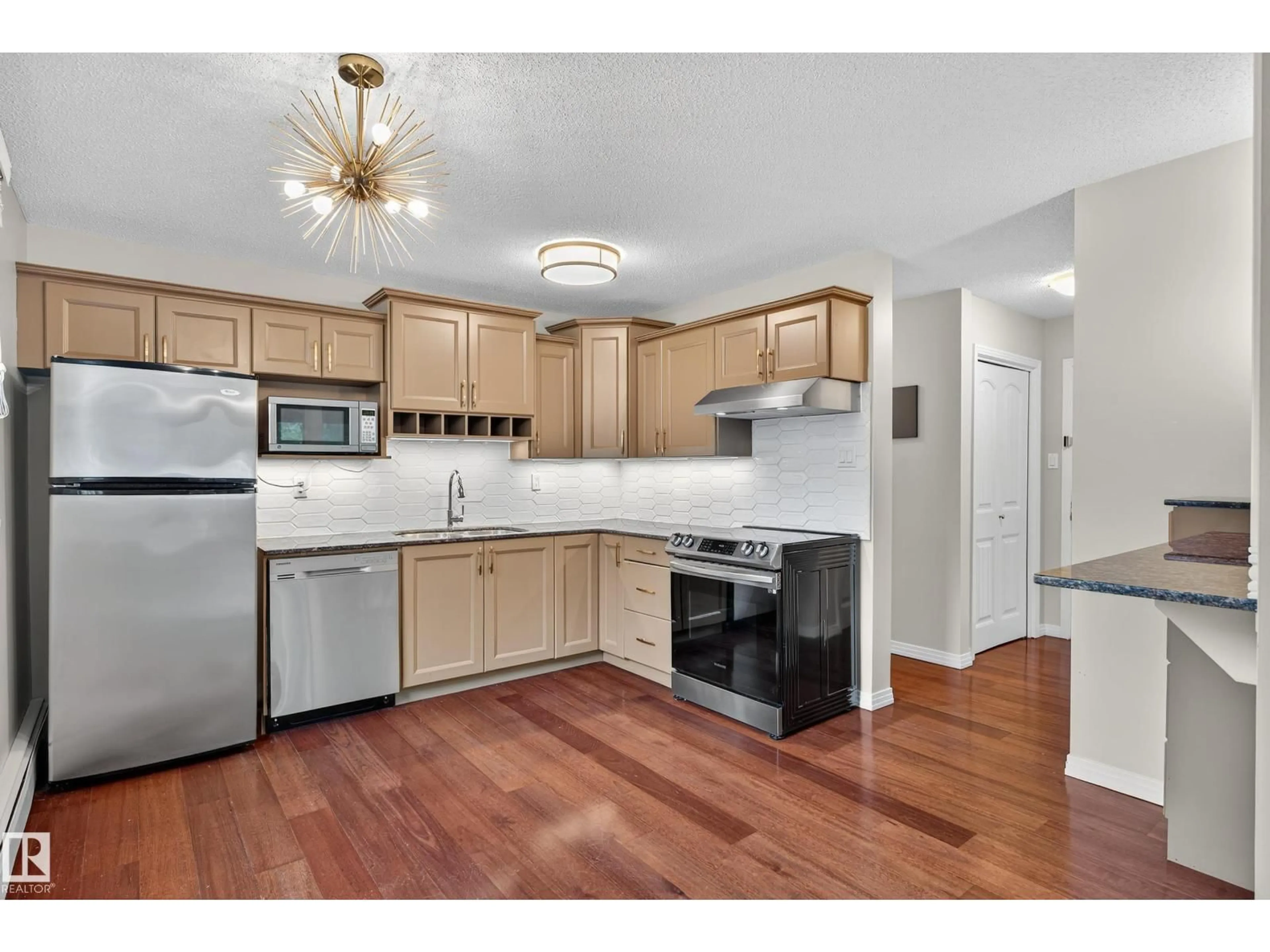 Open concept kitchen, wood/laminate floor for 202 - 10746 80 AV, Edmonton Alberta T6E1V8