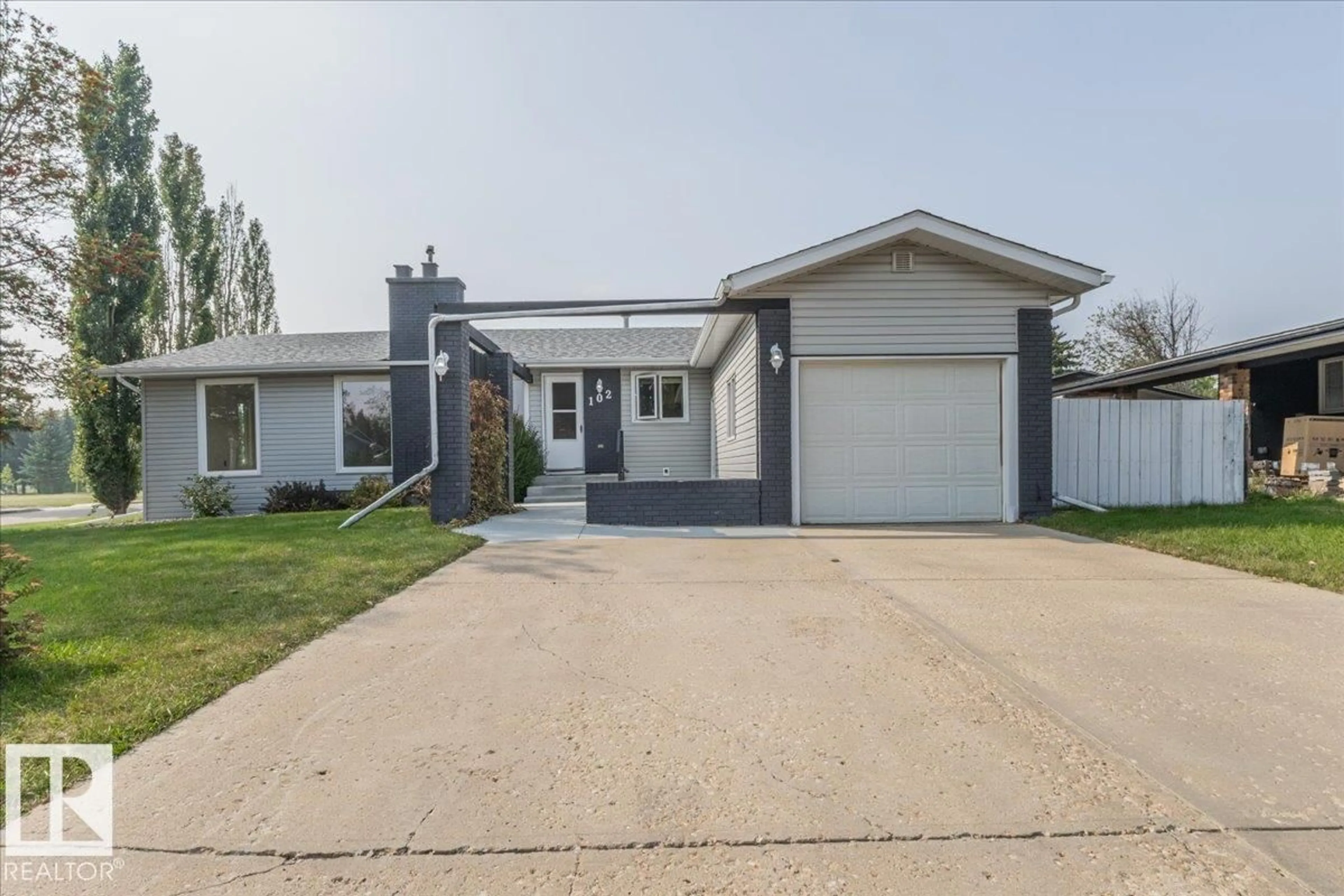 Home with vinyl exterior material, street for 102 MAPLE CR, Wetaskiwin Alberta T9A2E4