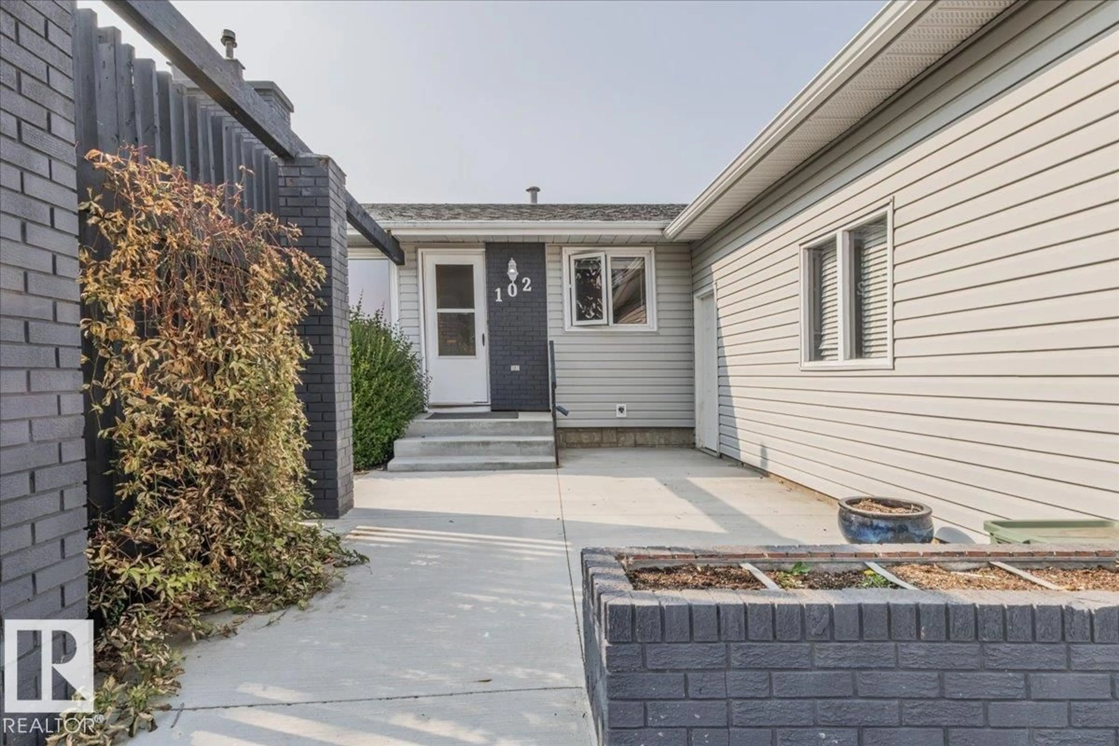 Home with vinyl exterior material, street for 102 MAPLE CR, Wetaskiwin Alberta T9A2E4