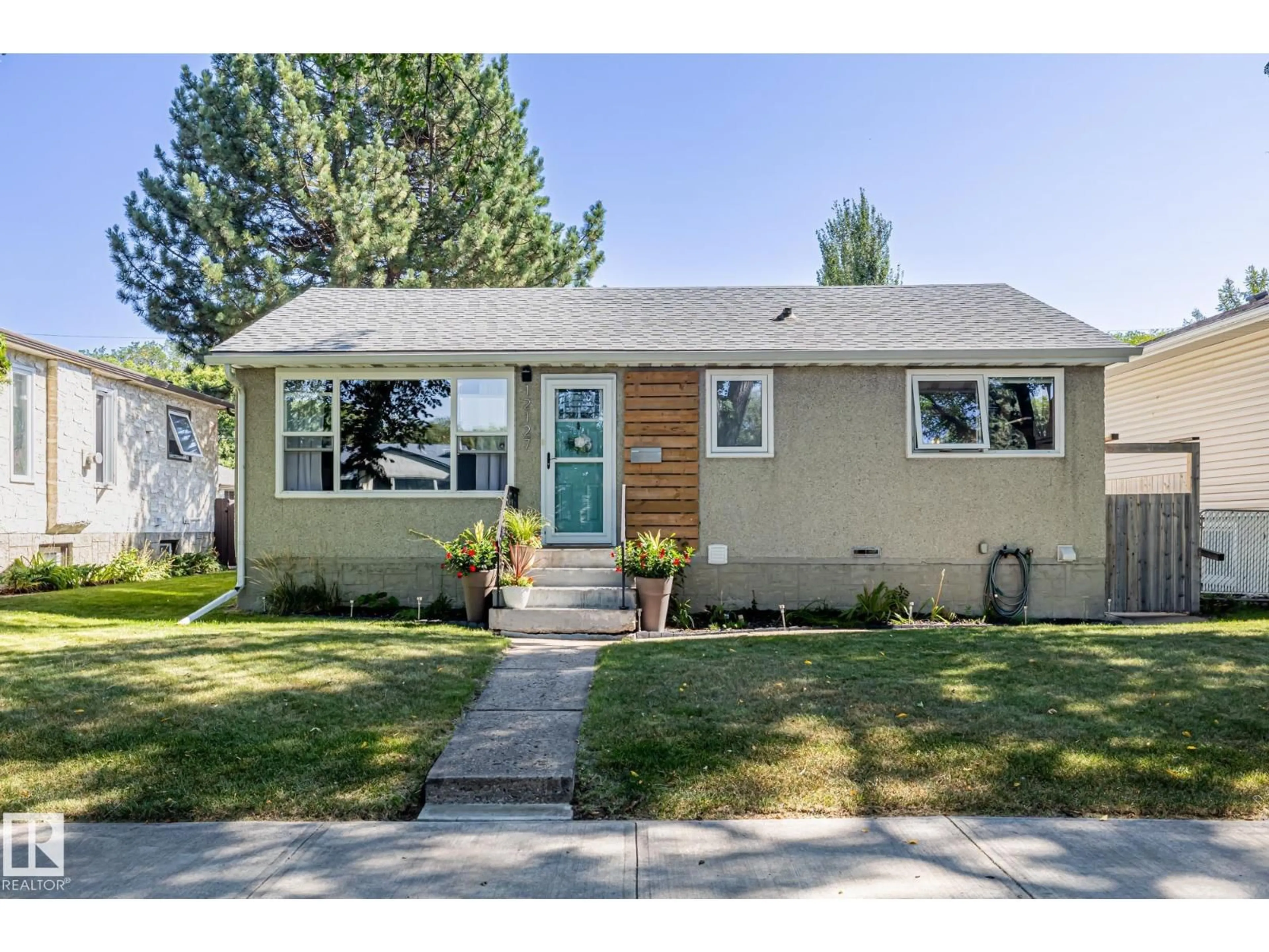 Home with vinyl exterior material, street for NW - 12127 61 ST, Edmonton Alberta T5W4B4