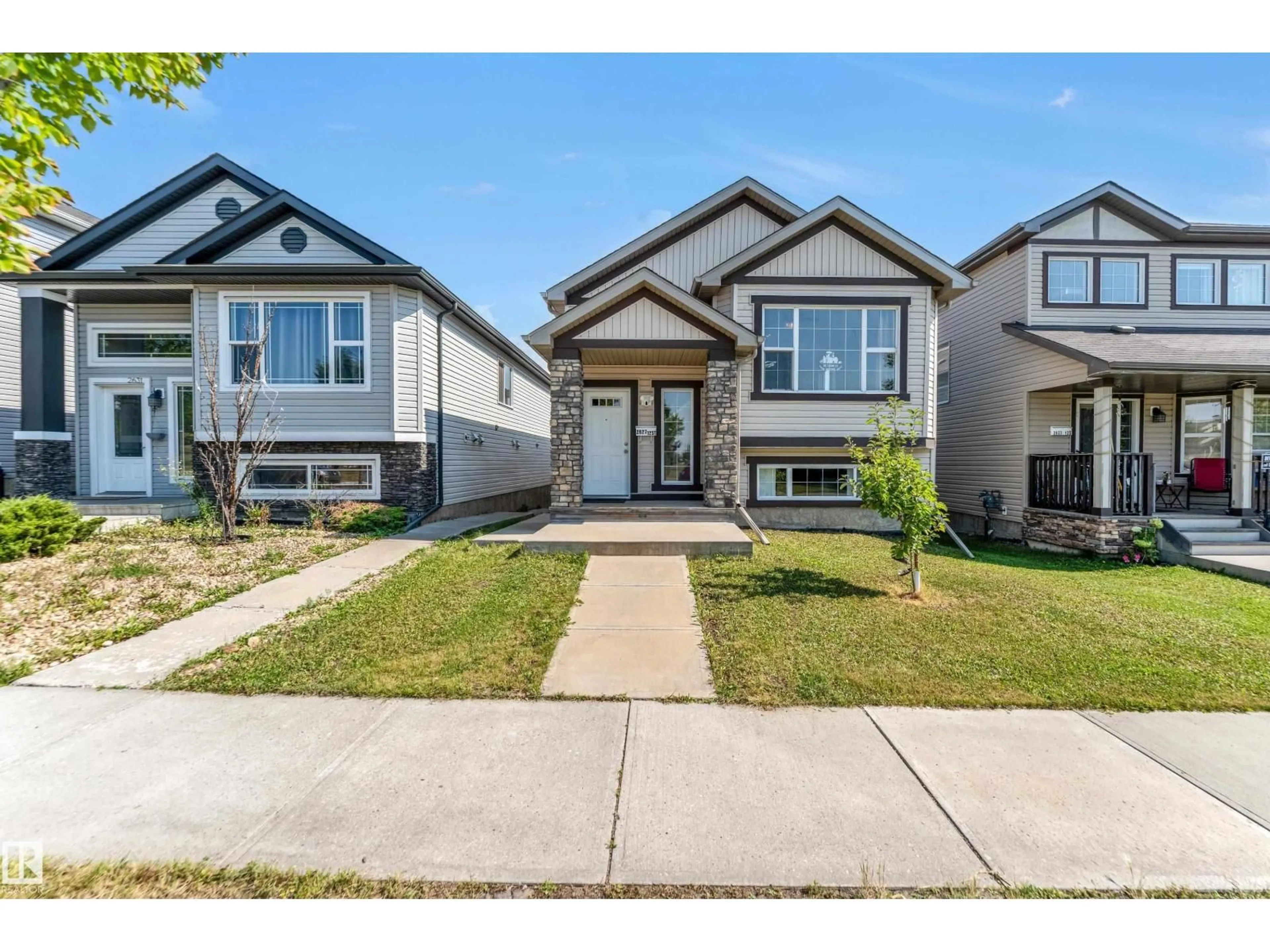 Home with vinyl exterior material, street for 2627 12 ST, Edmonton Alberta T6T0V9