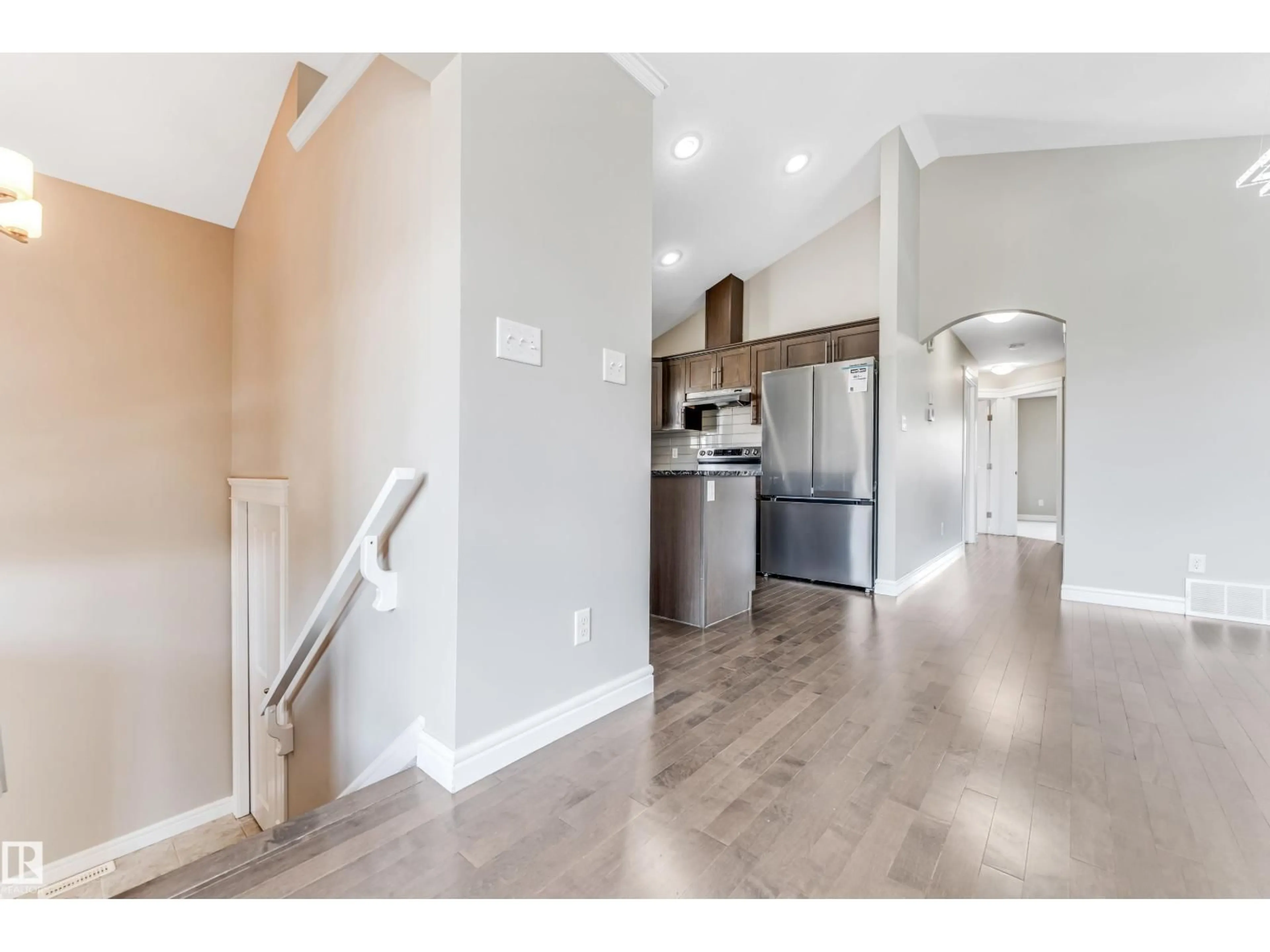 Open concept kitchen, wood/laminate floor for 2627 12 ST, Edmonton Alberta T6T0V9