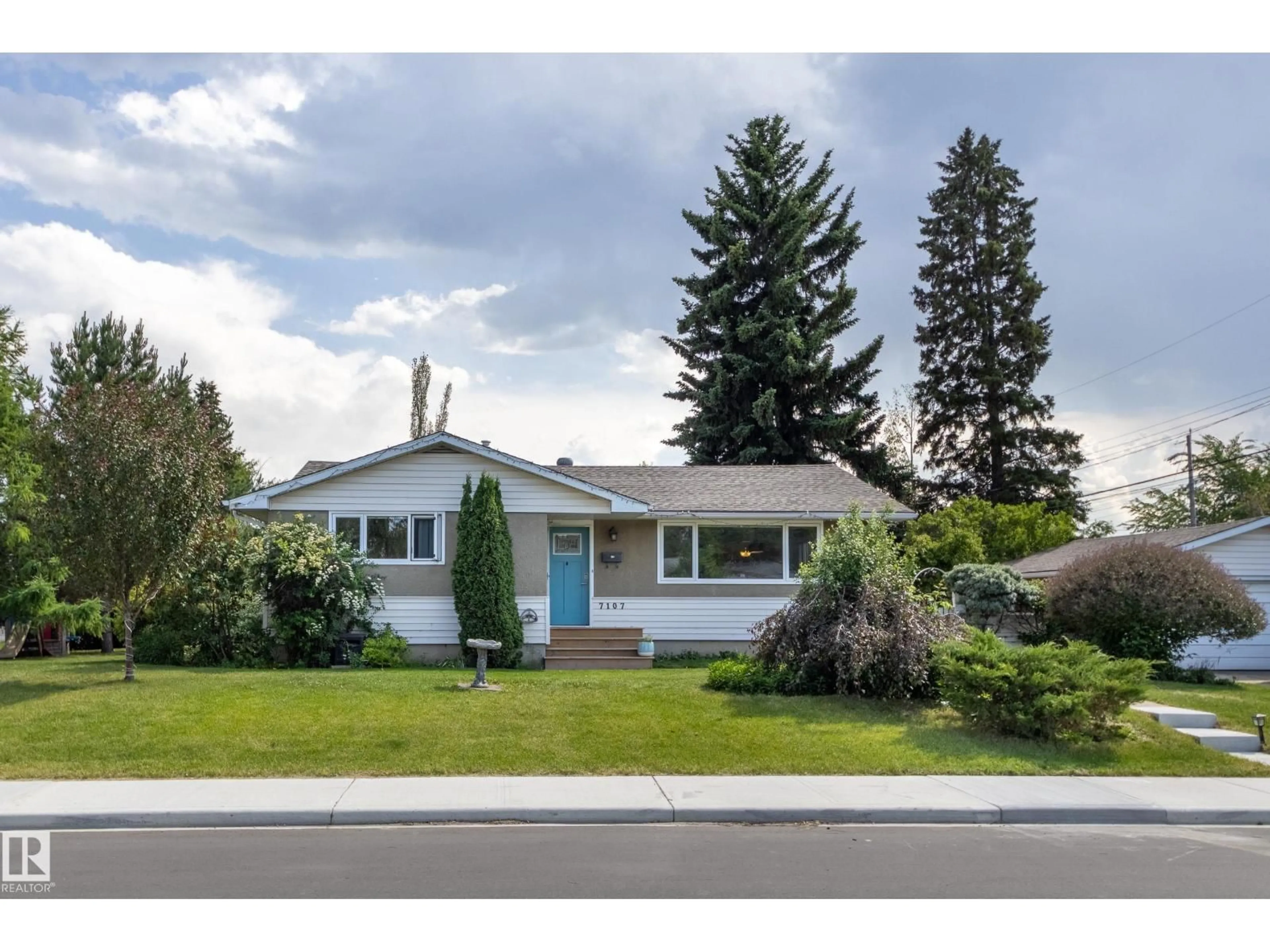 Home with vinyl exterior material, street for 7107 96B AV, Edmonton Alberta T6B1B9