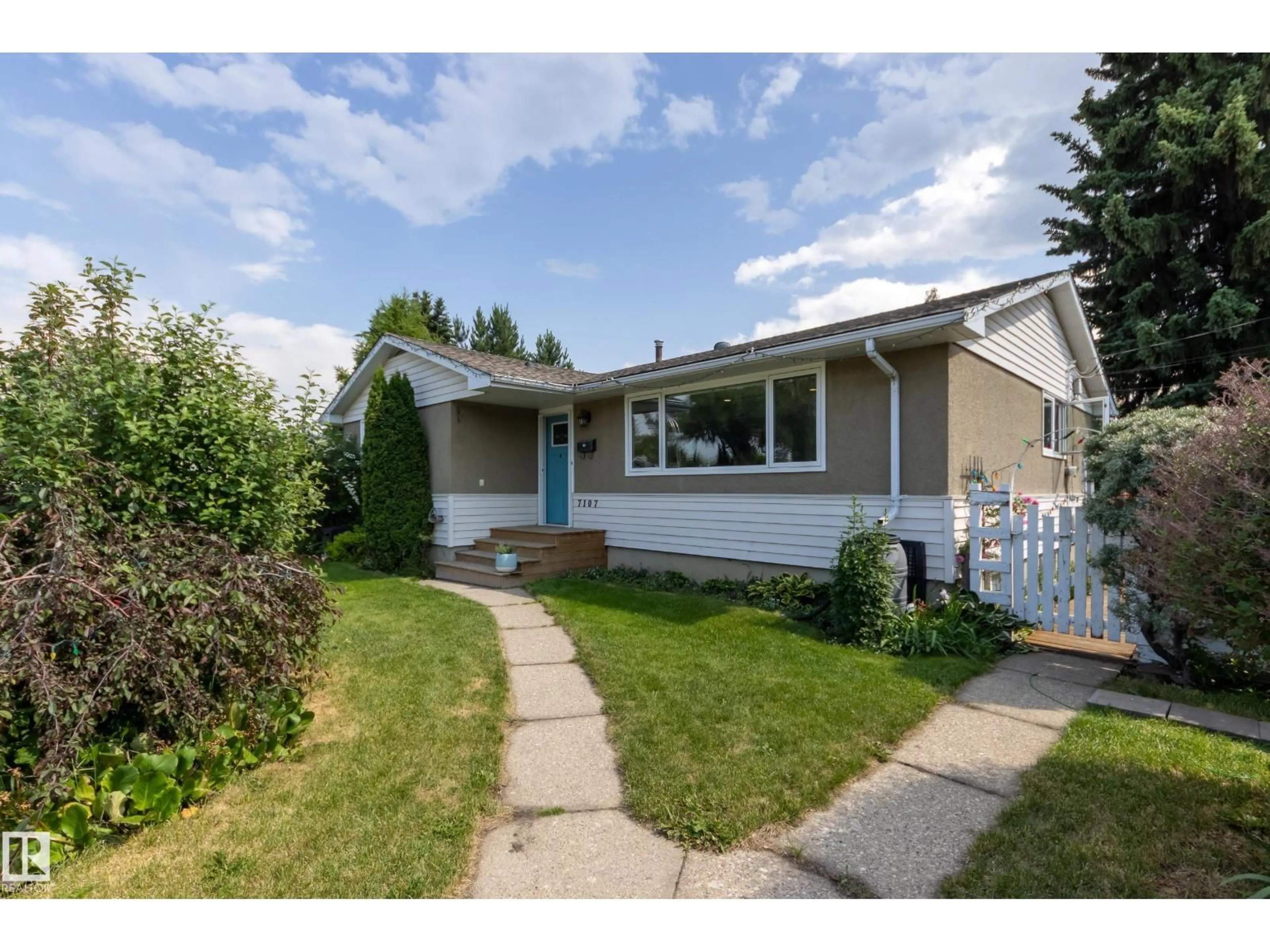 Home with vinyl exterior material, street for 7107 96B AV, Edmonton Alberta T6B1B9