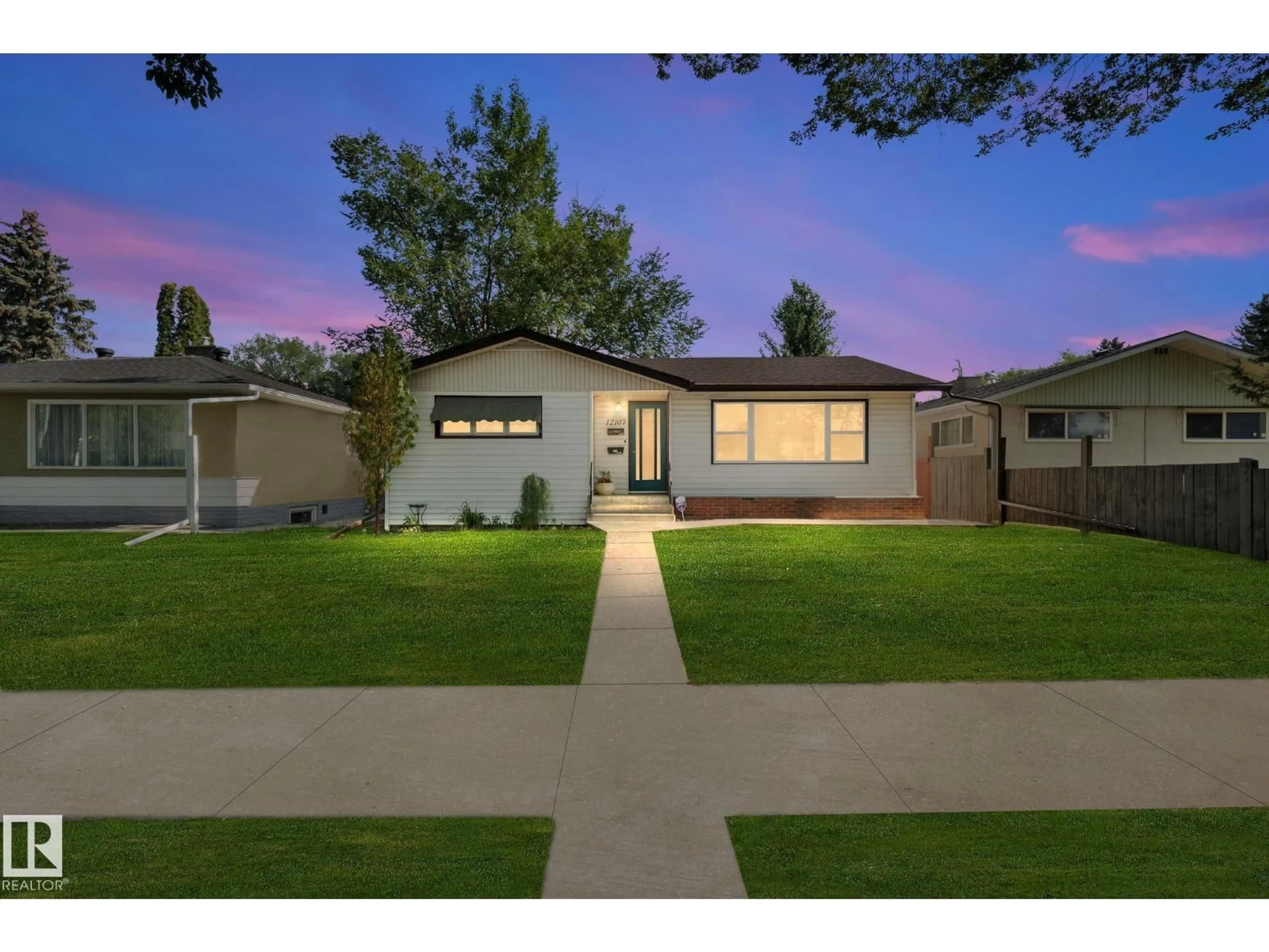 Home with vinyl exterior material, street for NW - 12107 53 ST, Edmonton Alberta T5W3L8
