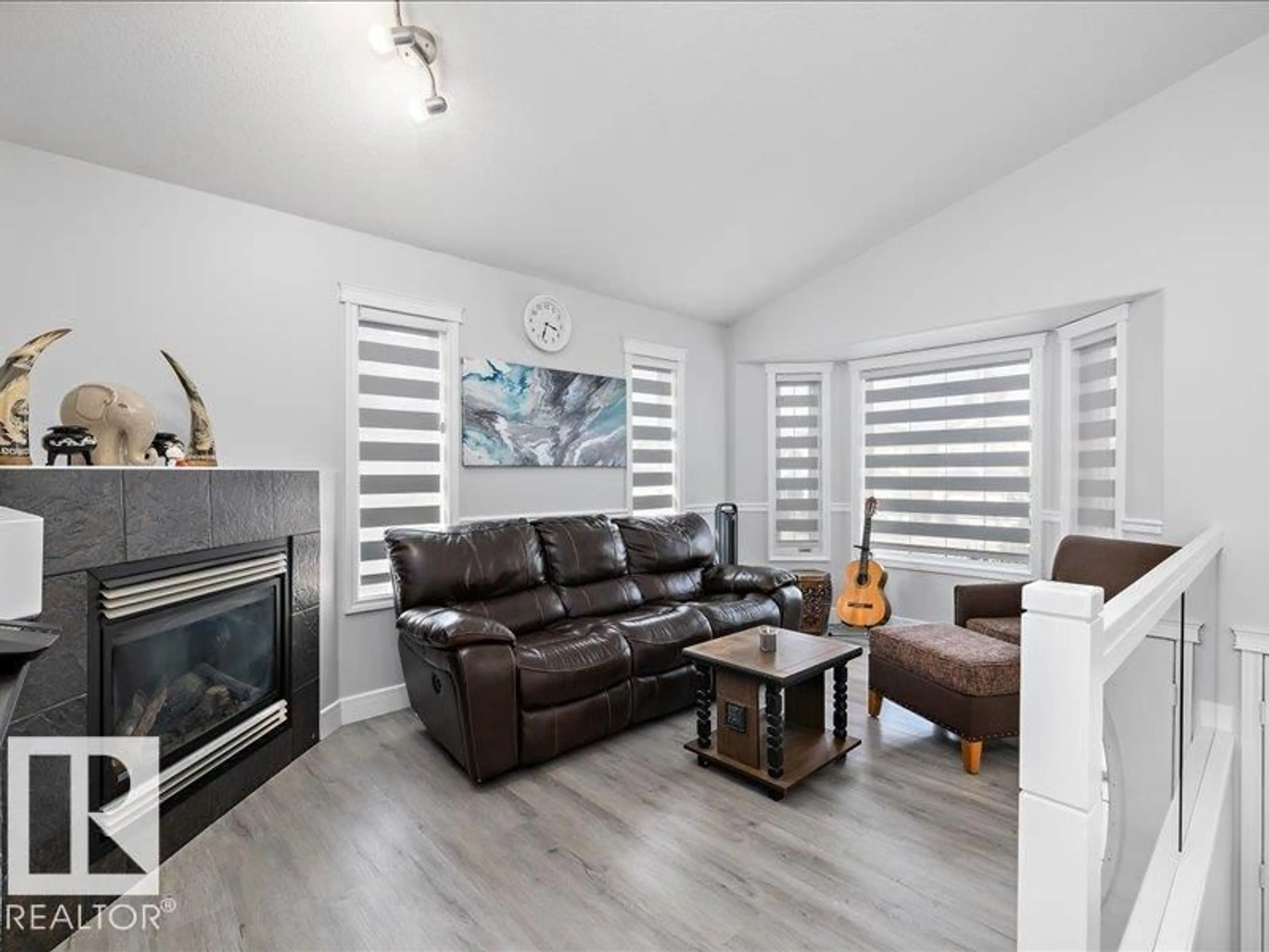 Living room with furniture, wood/laminate floor for 2919 151A AV, Edmonton Alberta T5Y2Y5