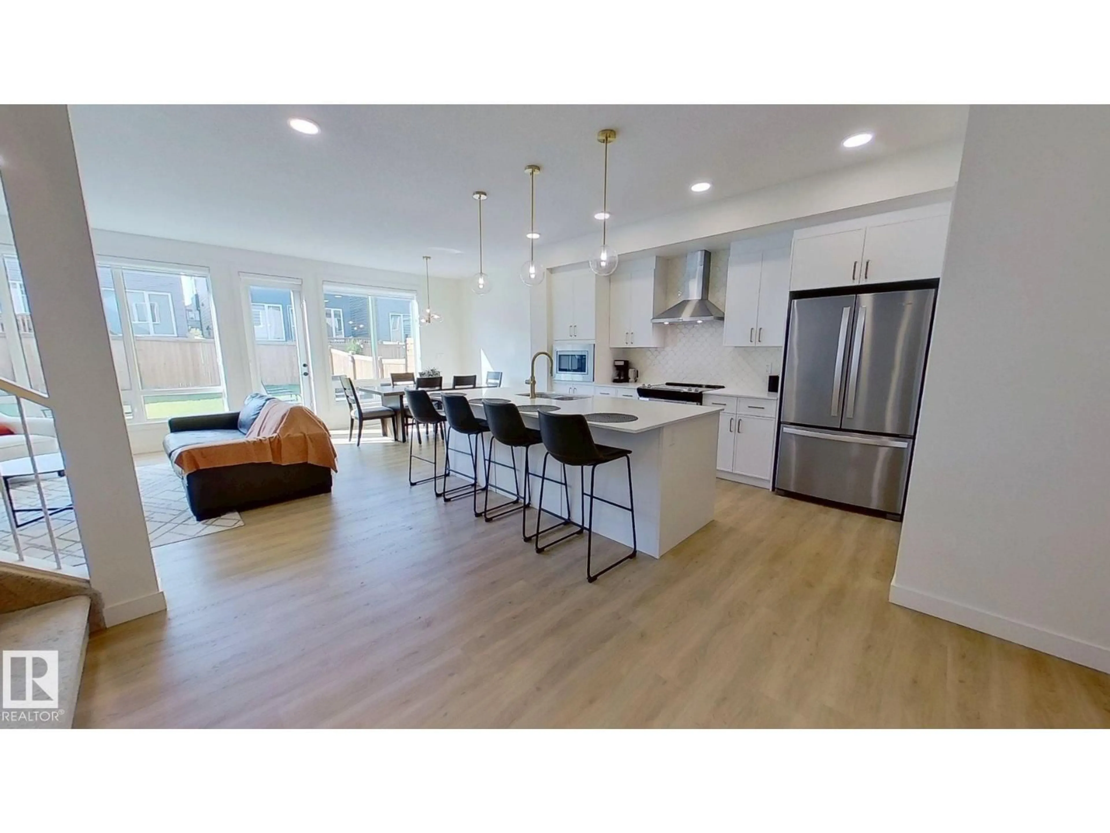Open concept kitchen, wood/laminate floor for 9238 PEAR DR, Edmonton Alberta T6X2X5