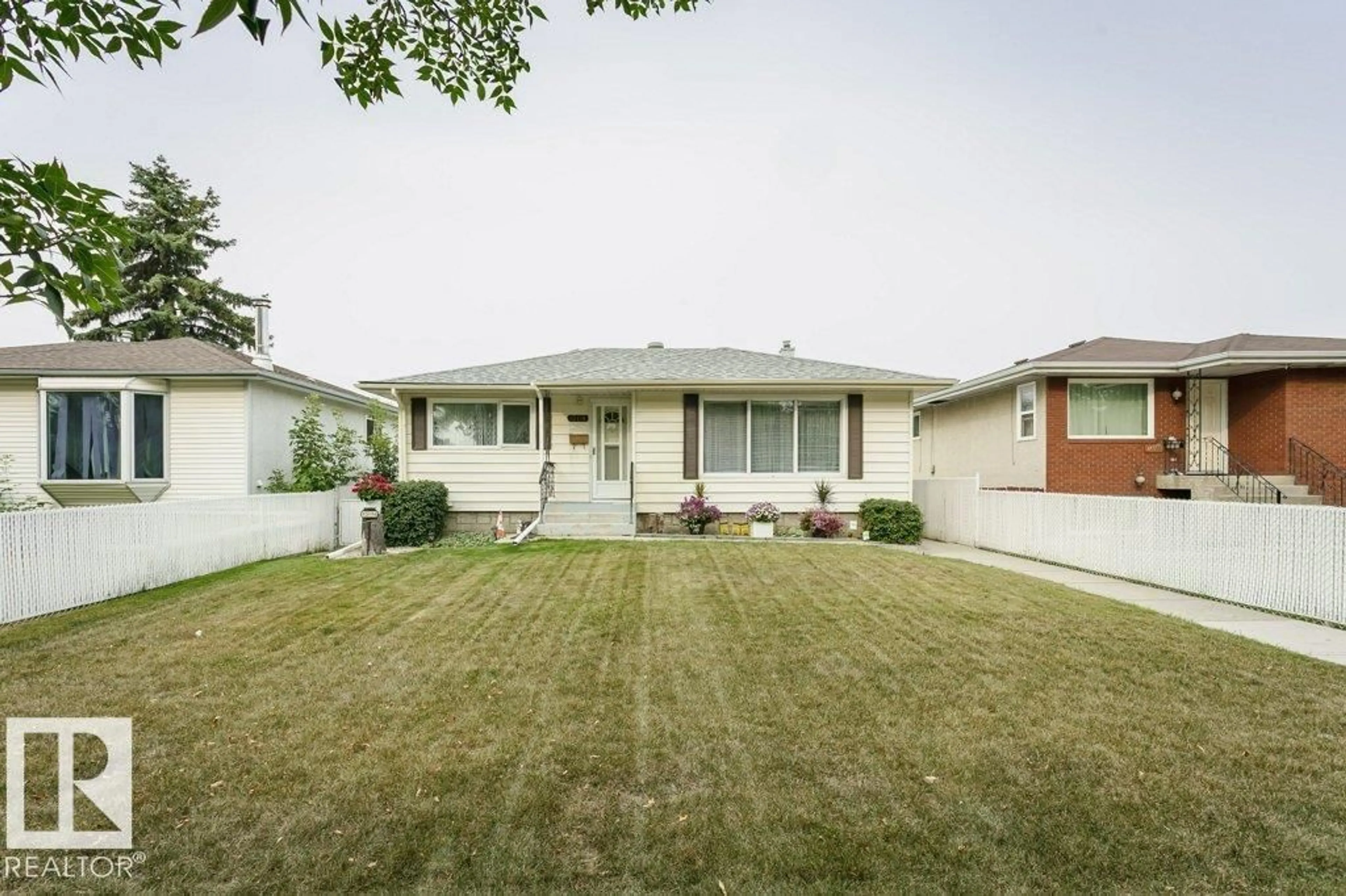 Home with vinyl exterior material, street for NW - 13114 101 ST, Edmonton Alberta T5E4E9