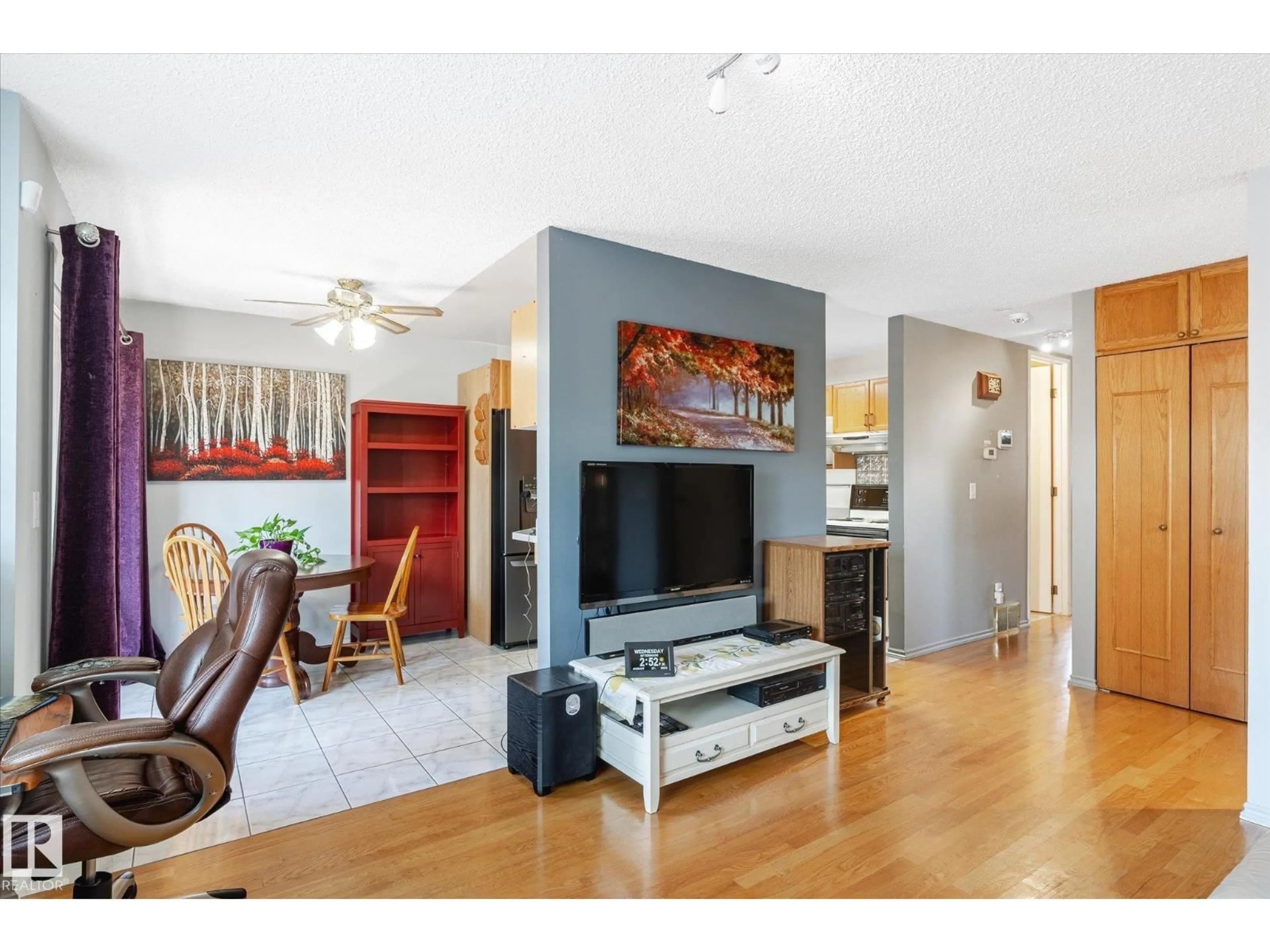 Living room with furniture, wood/laminate floor for #111 - 16725 106 ST, Edmonton Alberta T5X5G5