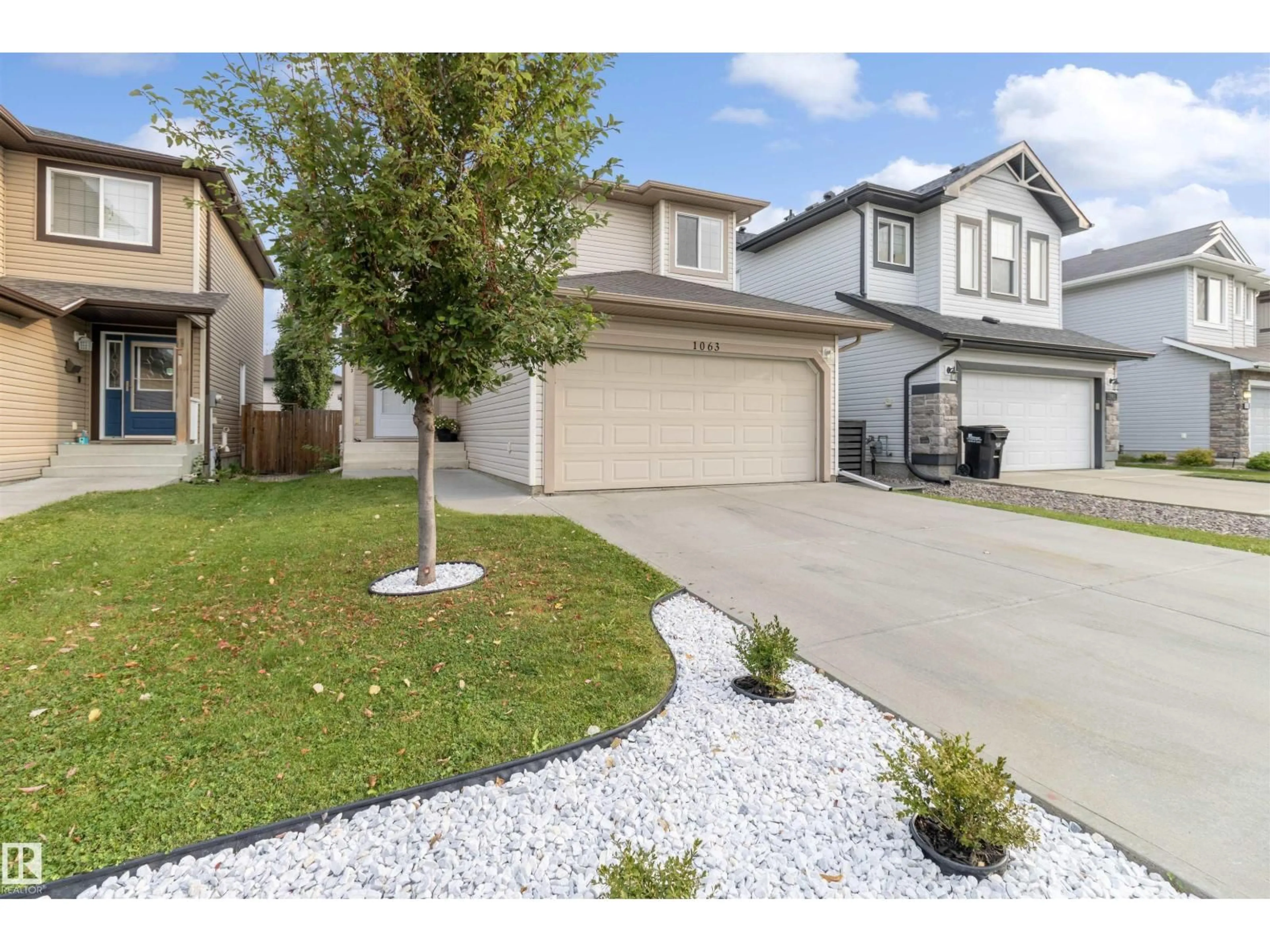Home with vinyl exterior material, street for 1063 FOXWOOD CR, Sherwood Park Alberta T8A4Y9