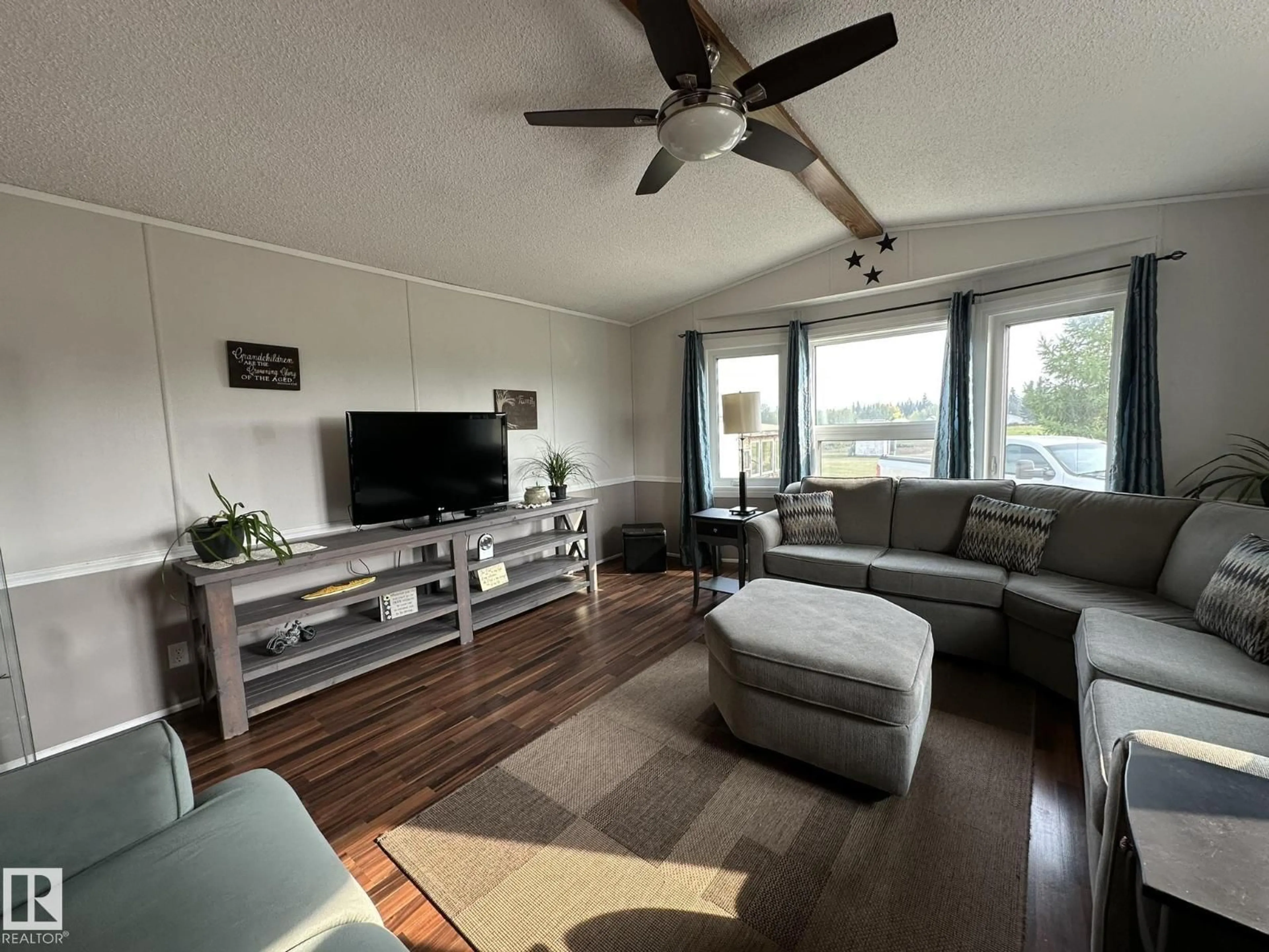 Living room with furniture, wood/laminate floor for 59413 RANGE 163 RD, Rural Smoky Lake County Alberta T0A3C0