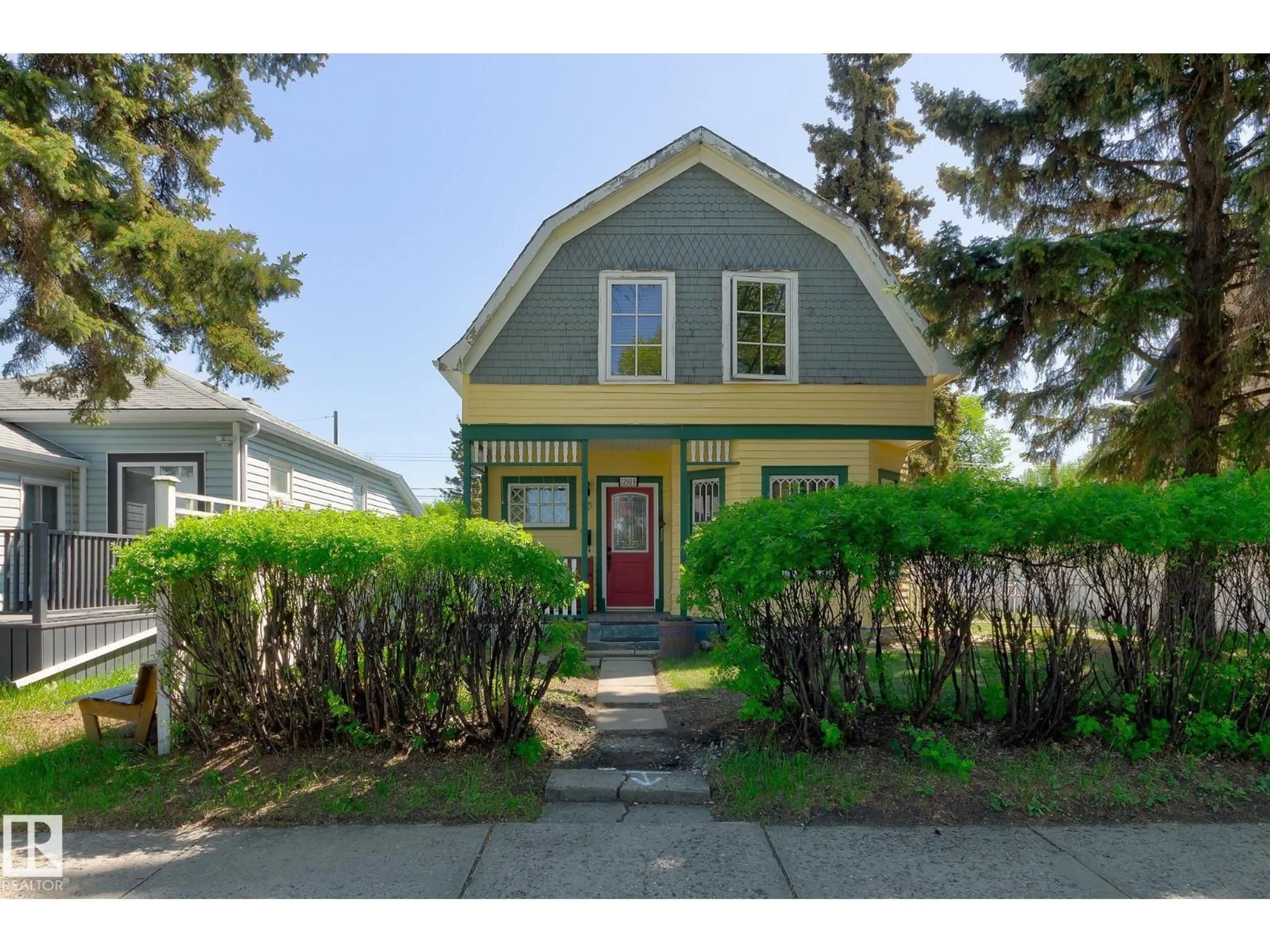 Home with vinyl exterior material, street for 12909 121 ST, Edmonton Alberta T5L0B3