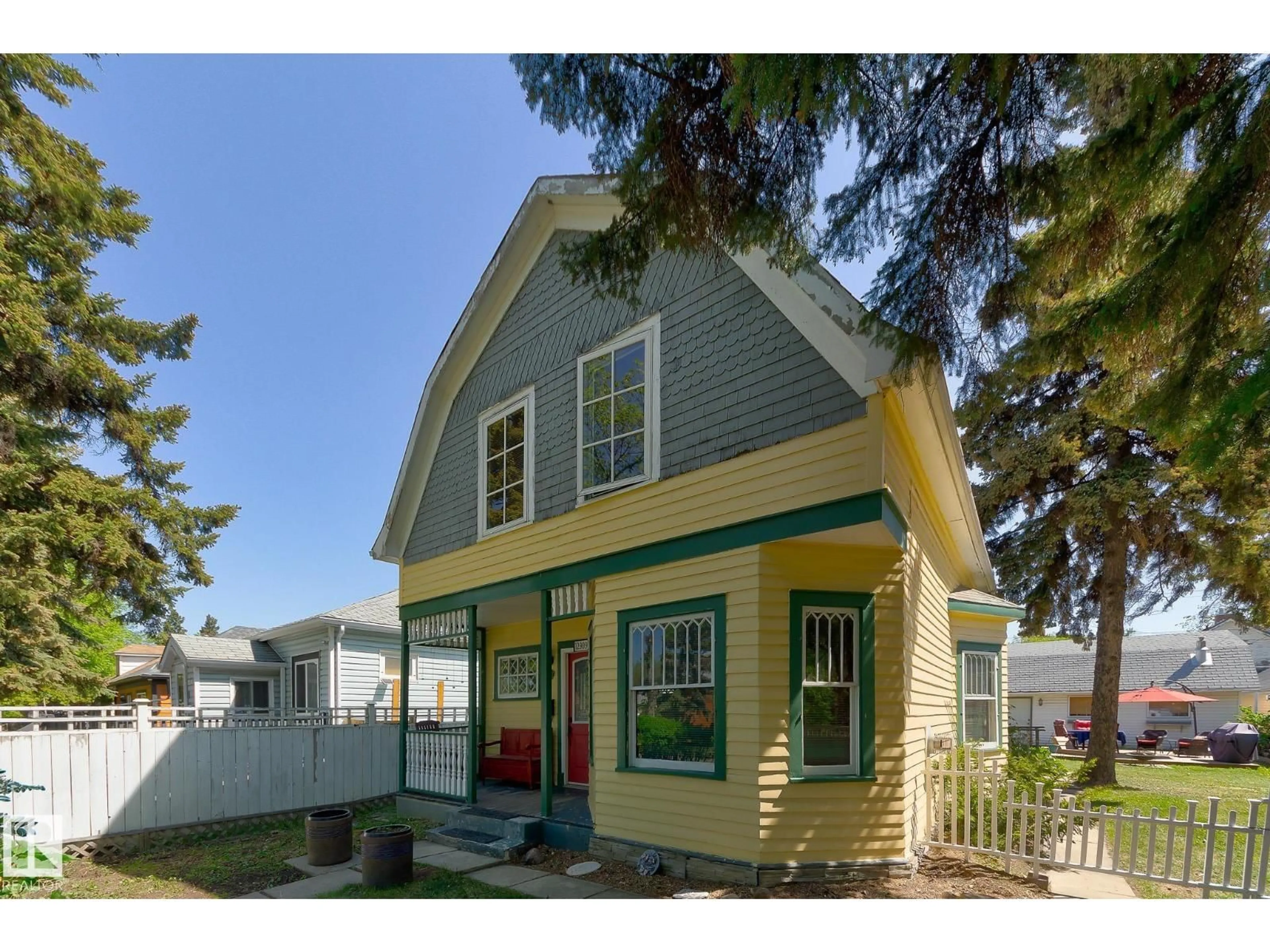 Home with vinyl exterior material, street for 12909 121 ST, Edmonton Alberta T5L0B3
