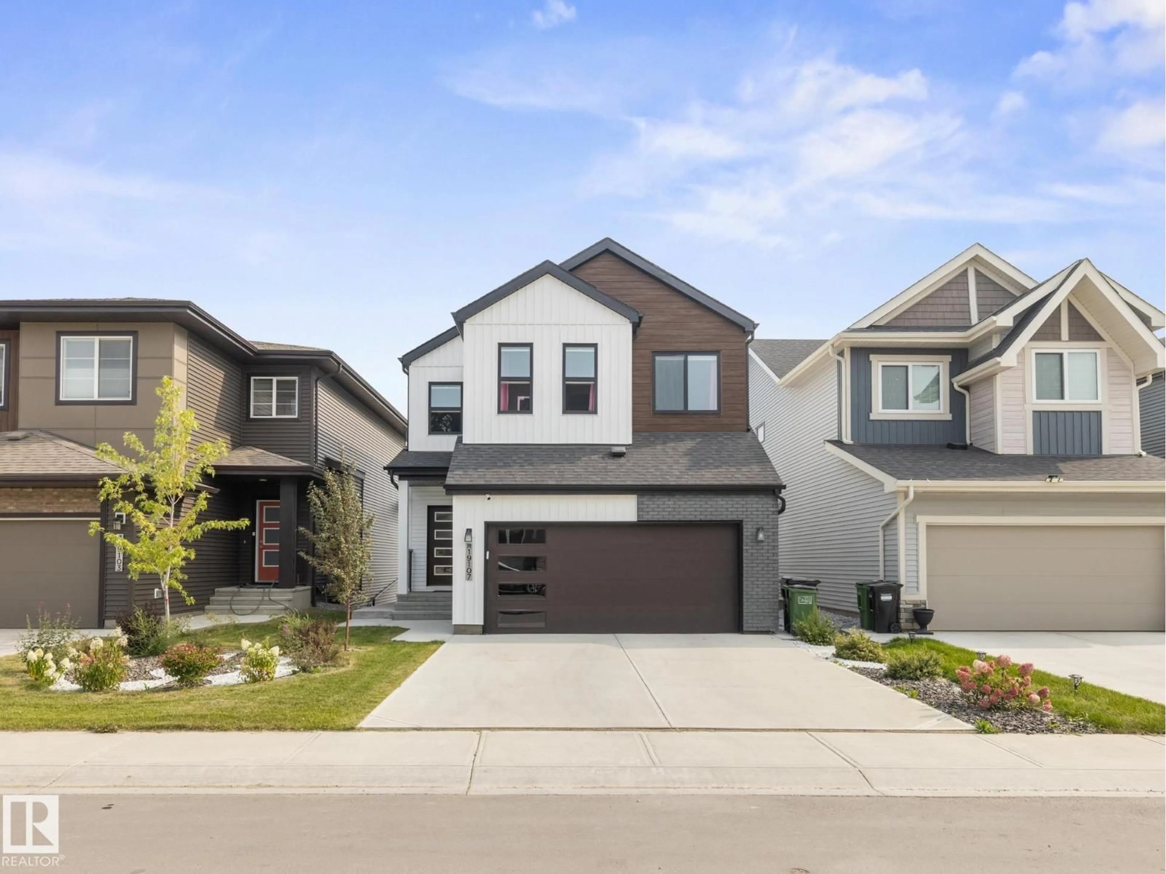 Home with vinyl exterior material, street for 19107 22 AV, Edmonton Alberta T6M1R1