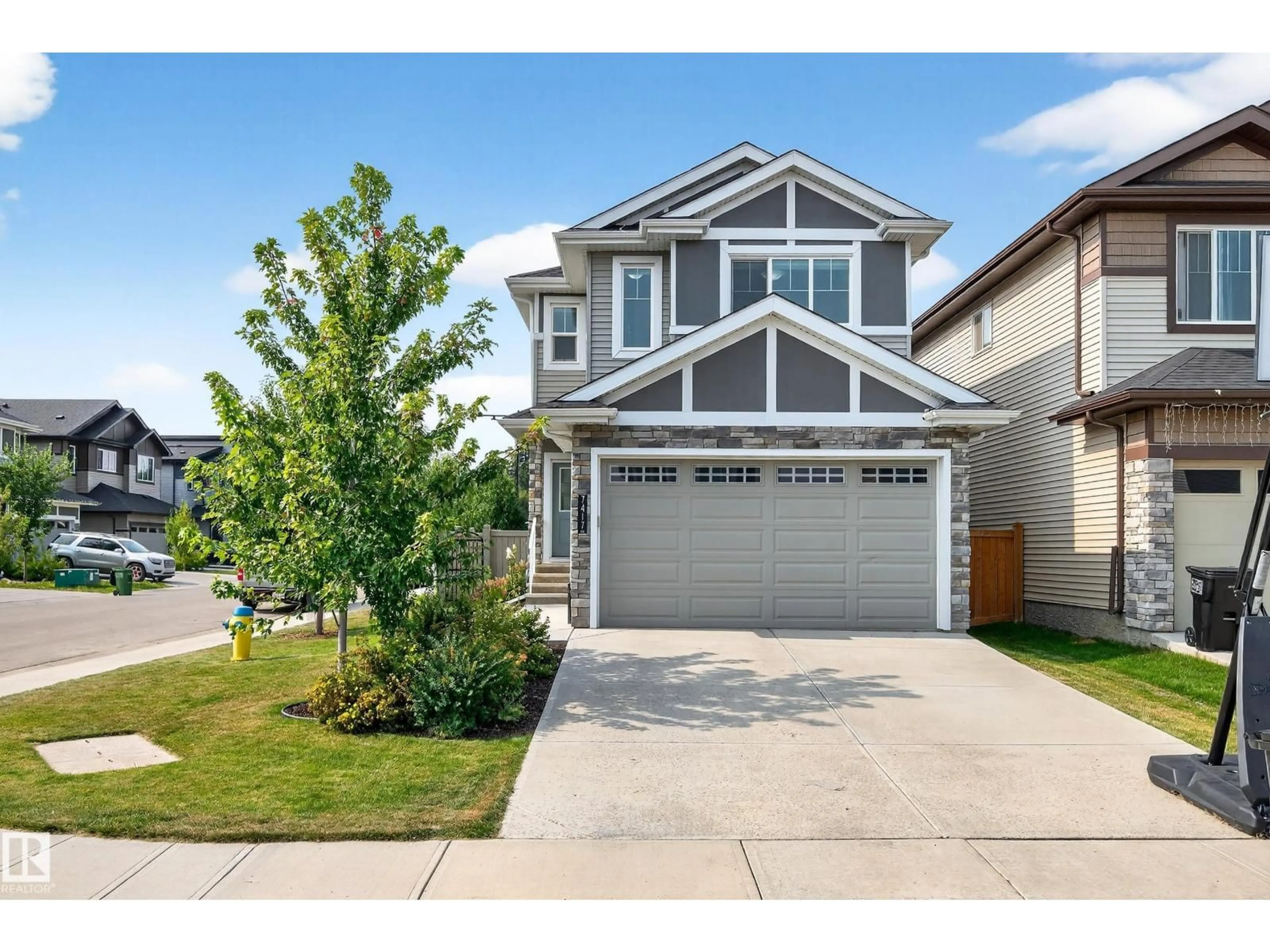 Home with vinyl exterior material, street for 7417 CHIVERS CR, Edmonton Alberta T6W4M2