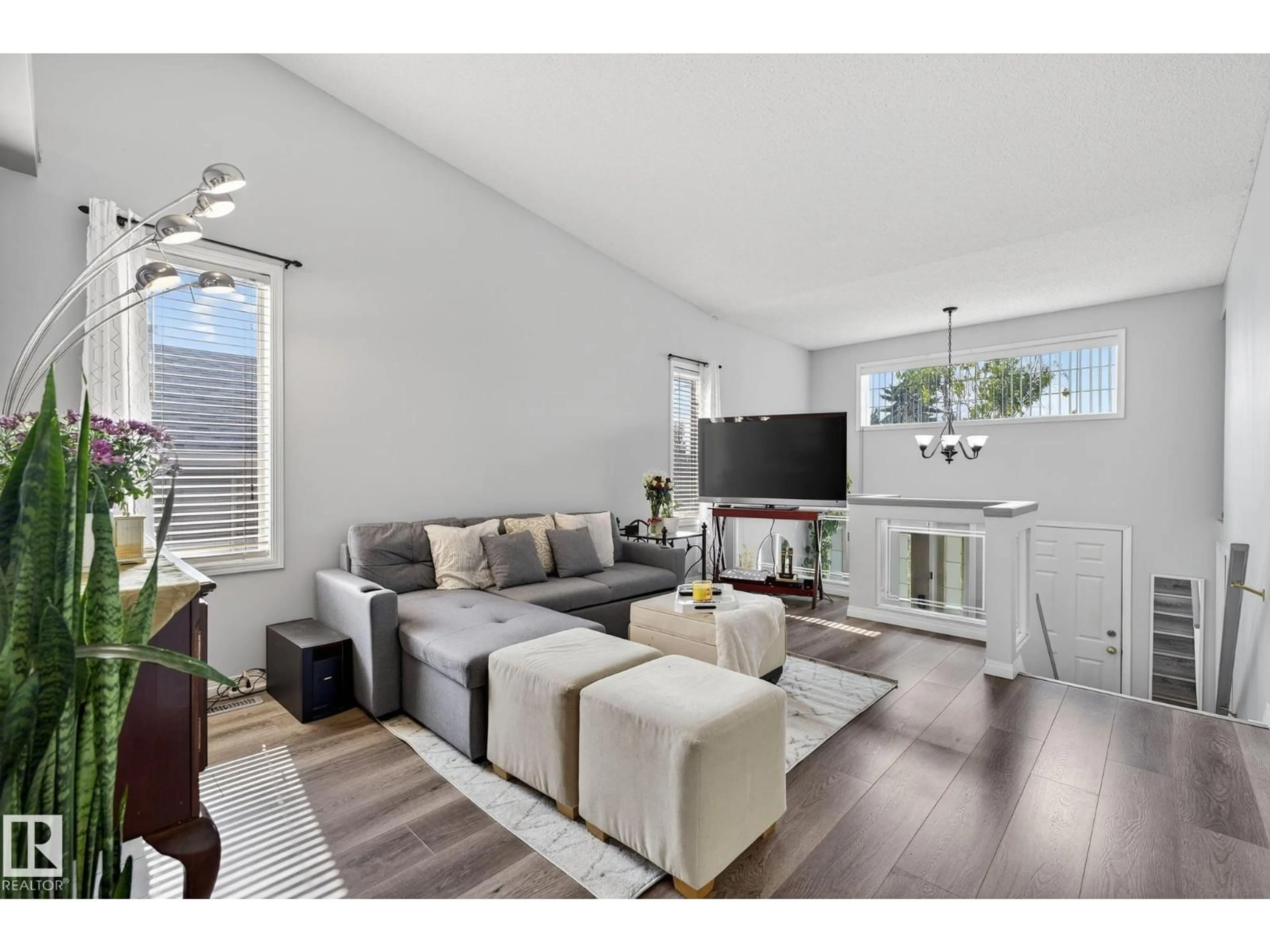 Living room with furniture, wood/laminate floor for 1051 JONES CR, Edmonton Alberta T6L6Y1