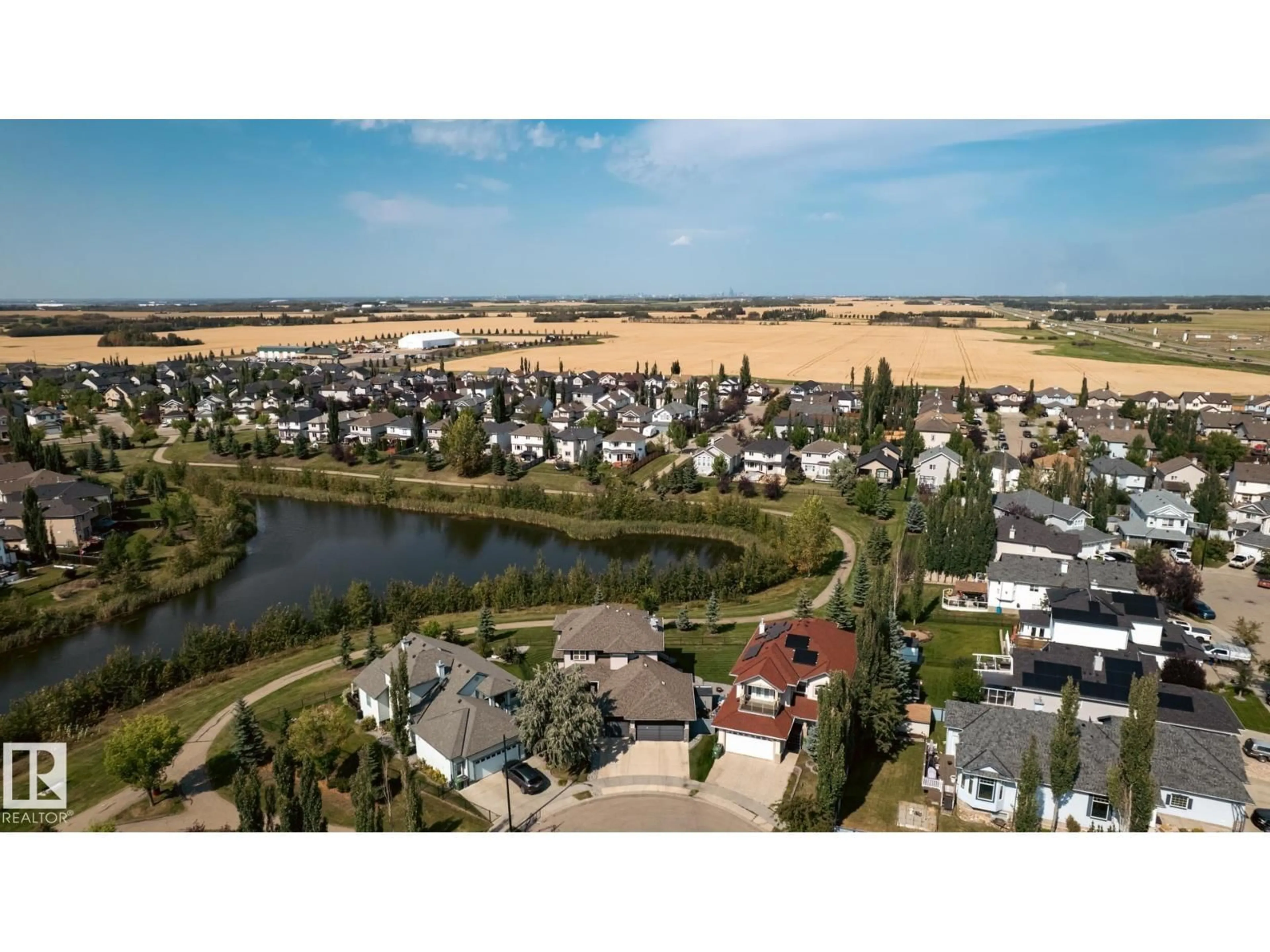 A pic from outside/outdoor area/front of a property/back of a property/a pic from drone, water/lake/river/ocean view for 52 POINTE MASSON, Beaumont Alberta T4X1S9