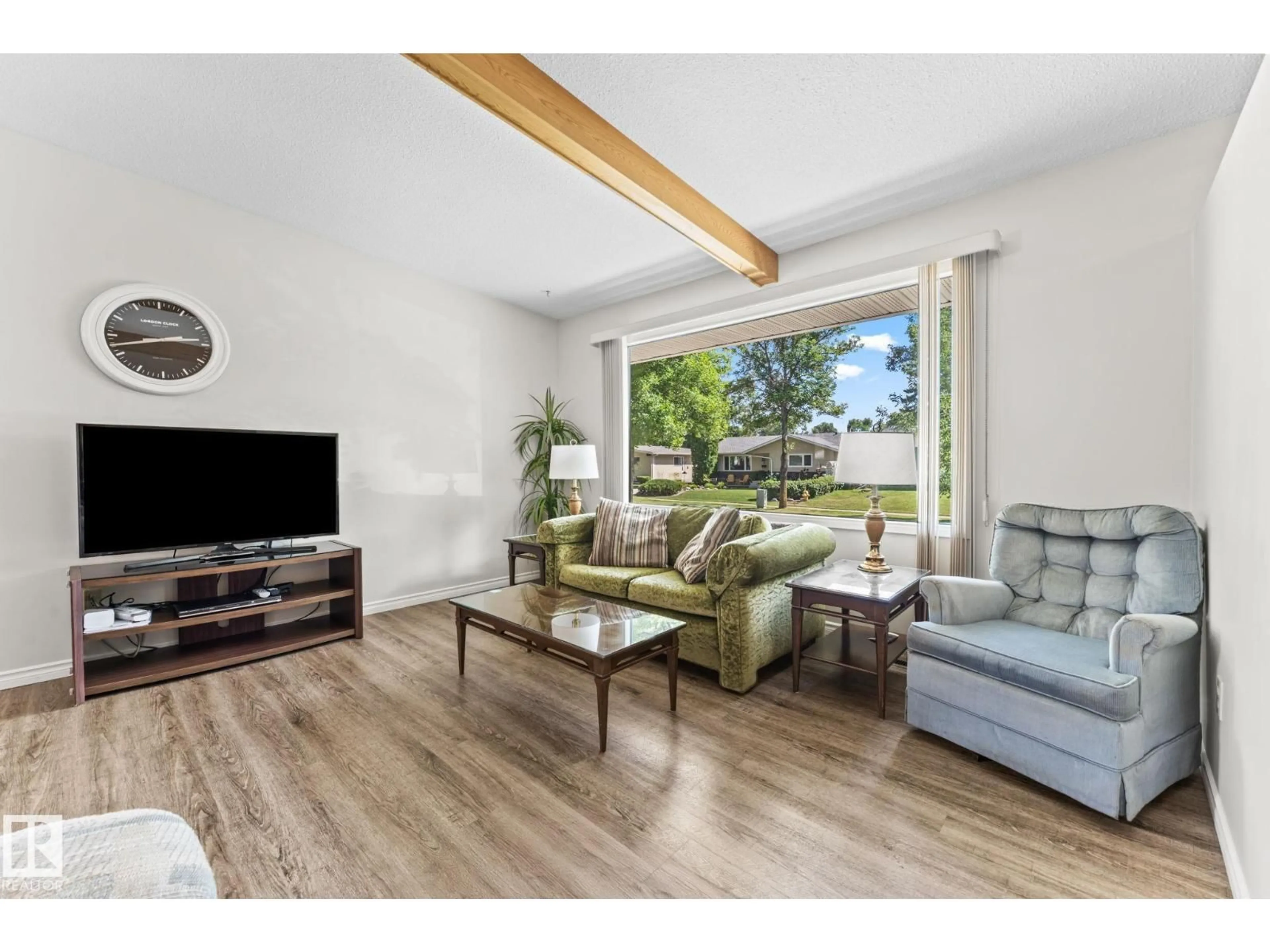 Living room with furniture, wood/laminate floor for 97 LAMBERT CR, St. Albert Alberta T8N1M5