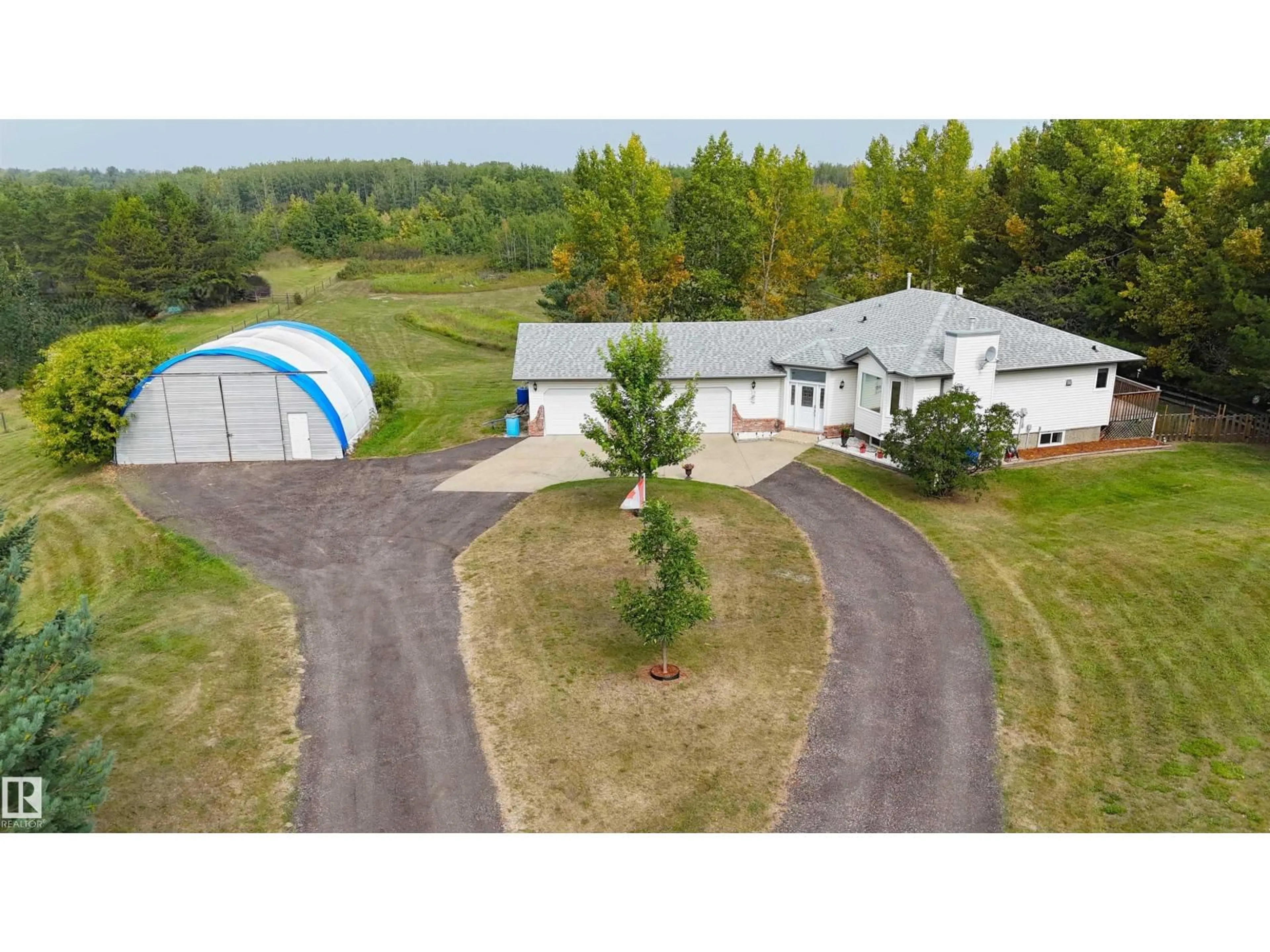 A pic from outside/outdoor area/front of a property/back of a property/a pic from drone, unknown for 20 52510 RGE ROAD 20, Rural Parkland County Alberta T7Y2G7