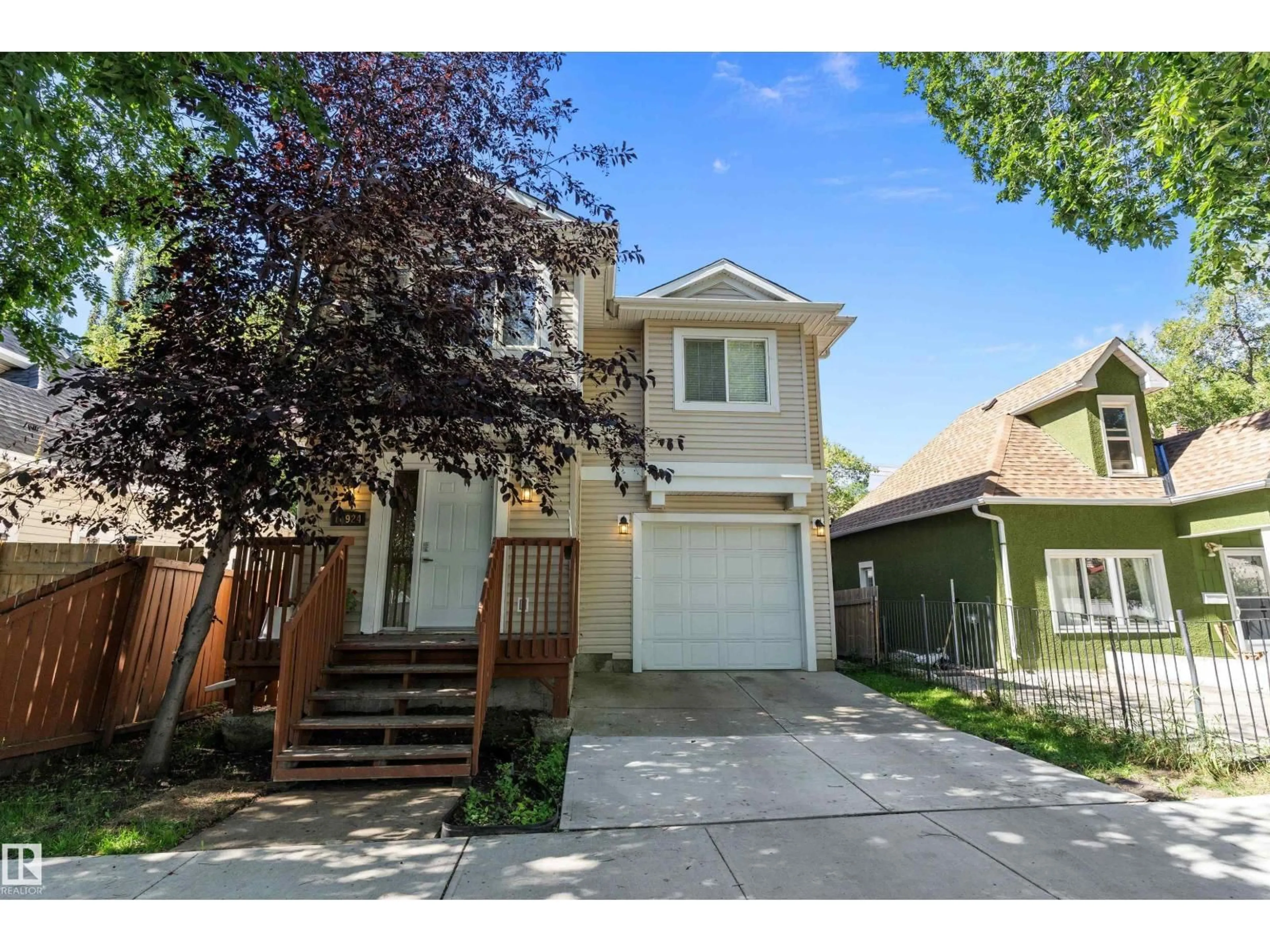 Home with vinyl exterior material, street for 10924 92 ST, Edmonton Alberta T5H1W1