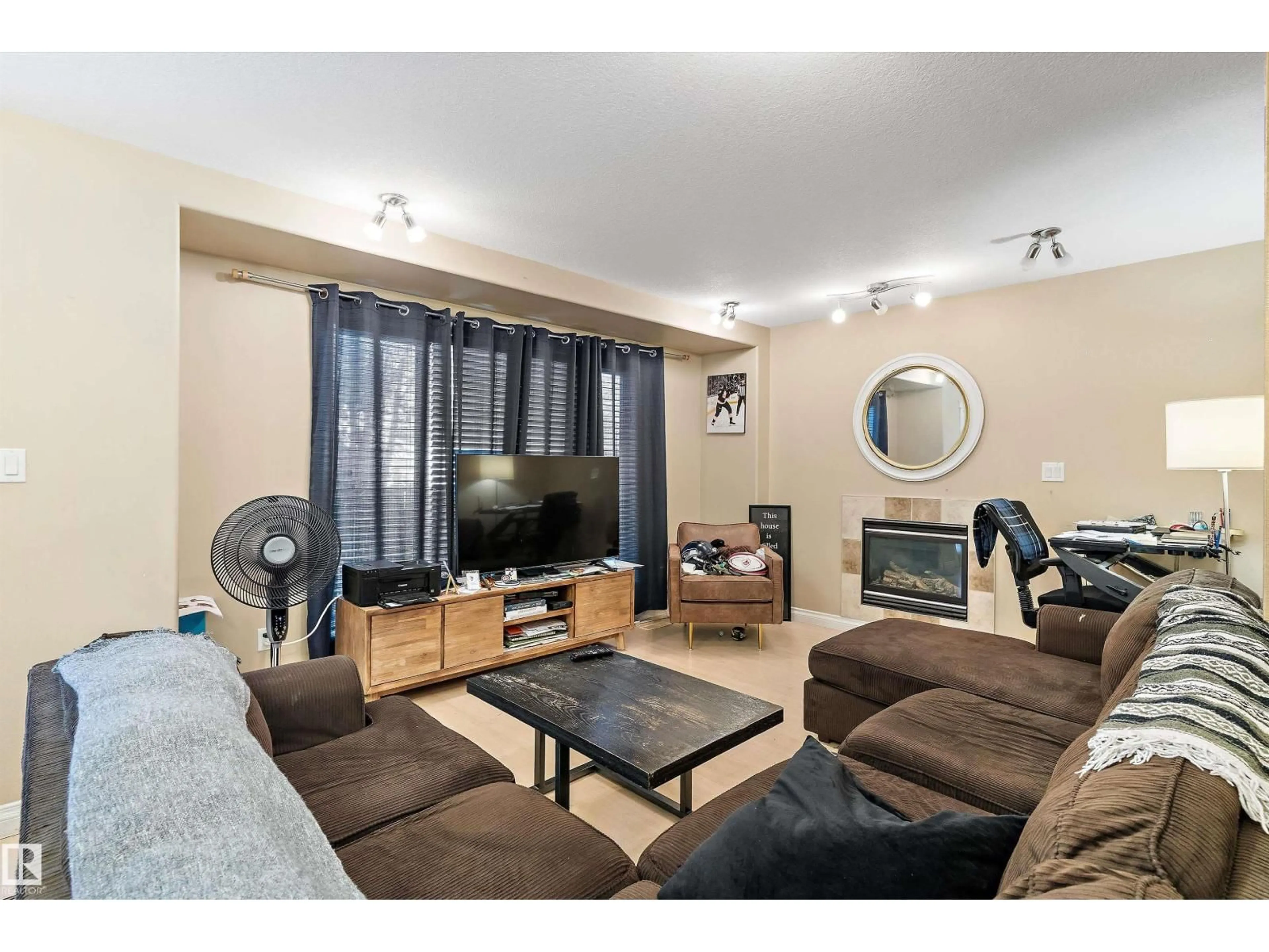 Living room with furniture, unknown for 10924 92 ST, Edmonton Alberta T5H1W1