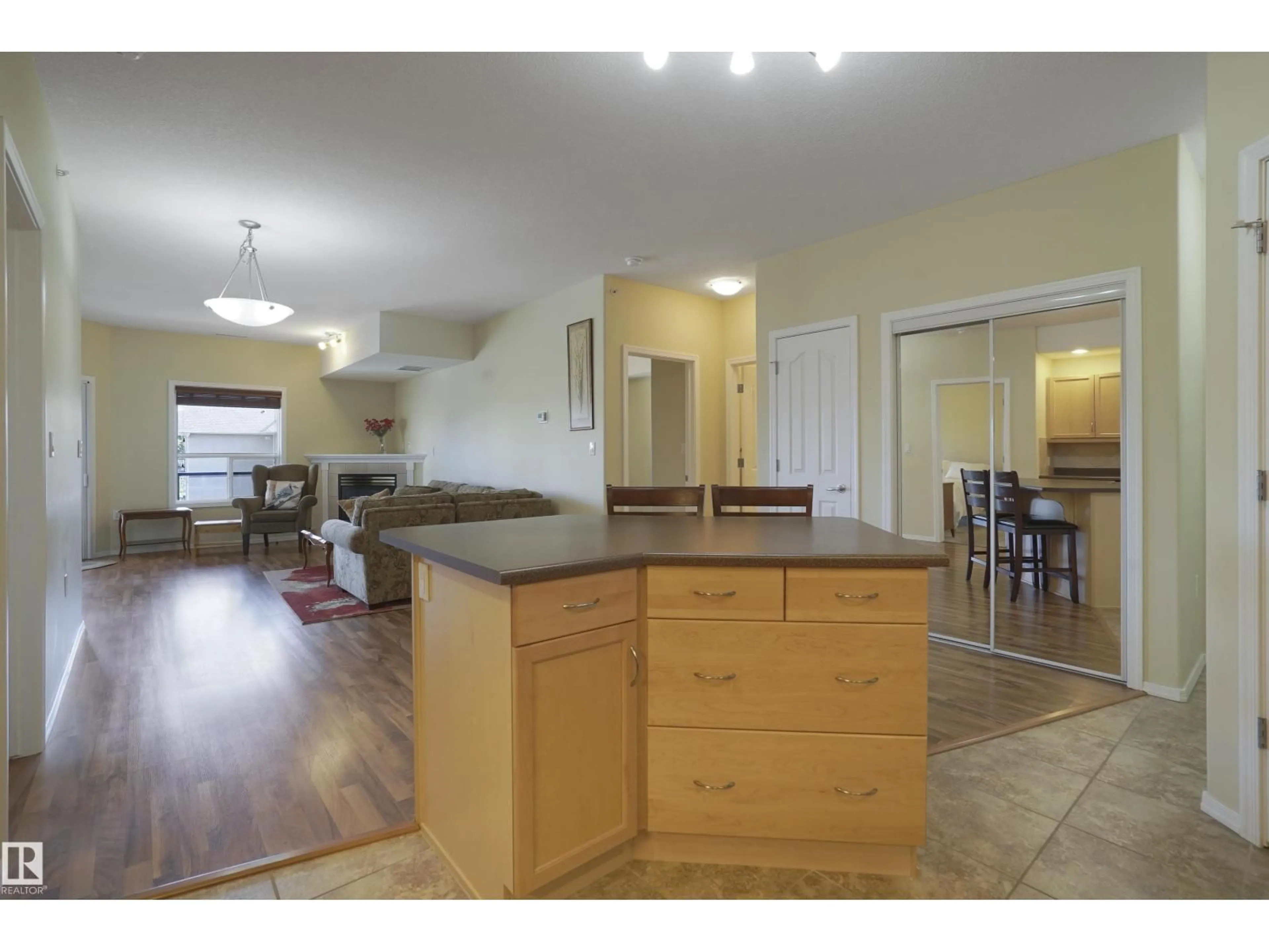 Open concept kitchen, wood/laminate floor for #402 - 1320 RUTHERFORD RD, Edmonton Alberta T6W0B6