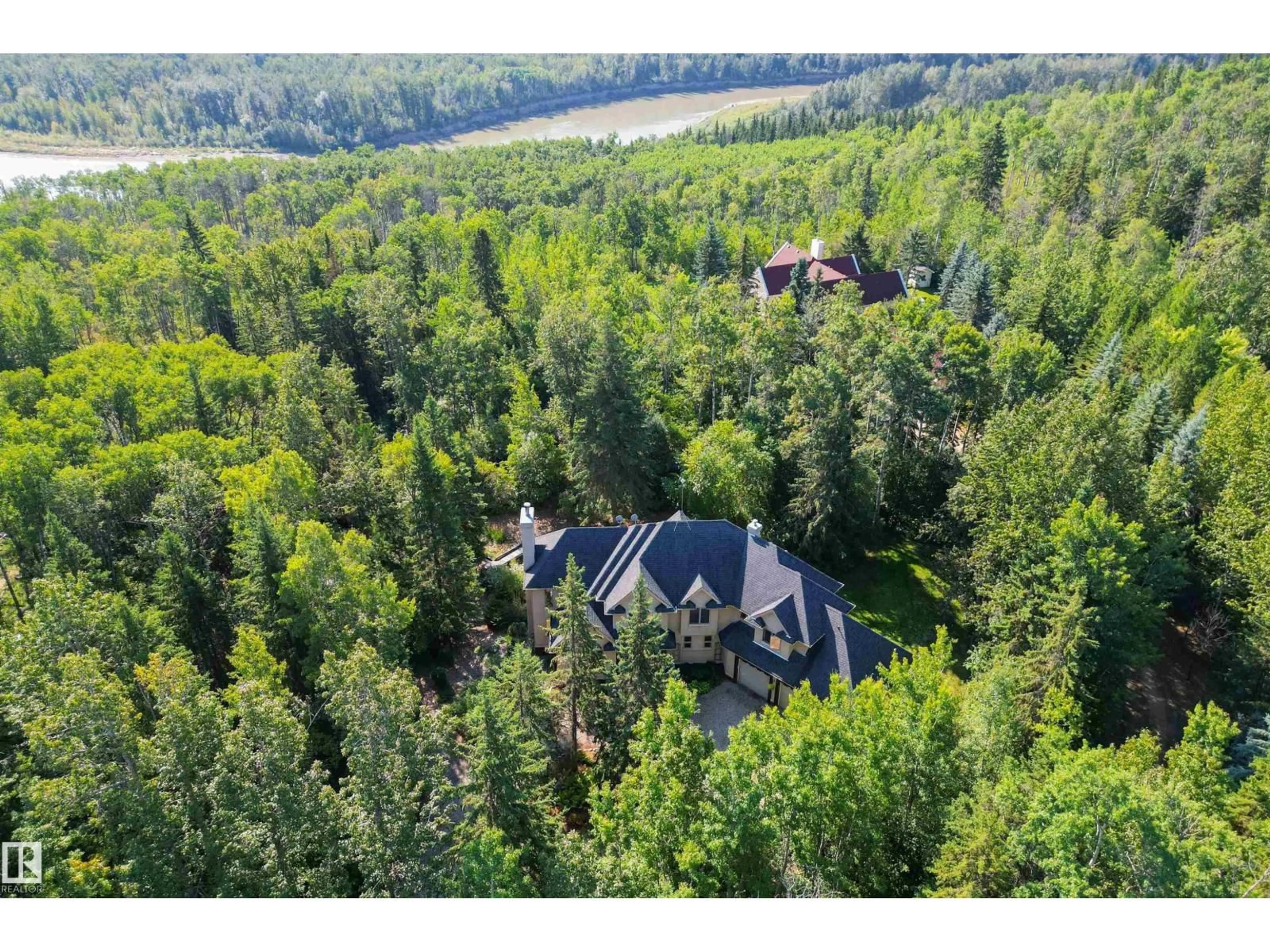 A pic from outside/outdoor area/front of a property/back of a property/a pic from drone, forest/trees view for 27107 TWP ROAD 510 NE, Rural Parkland County Alberta T7Y1H6