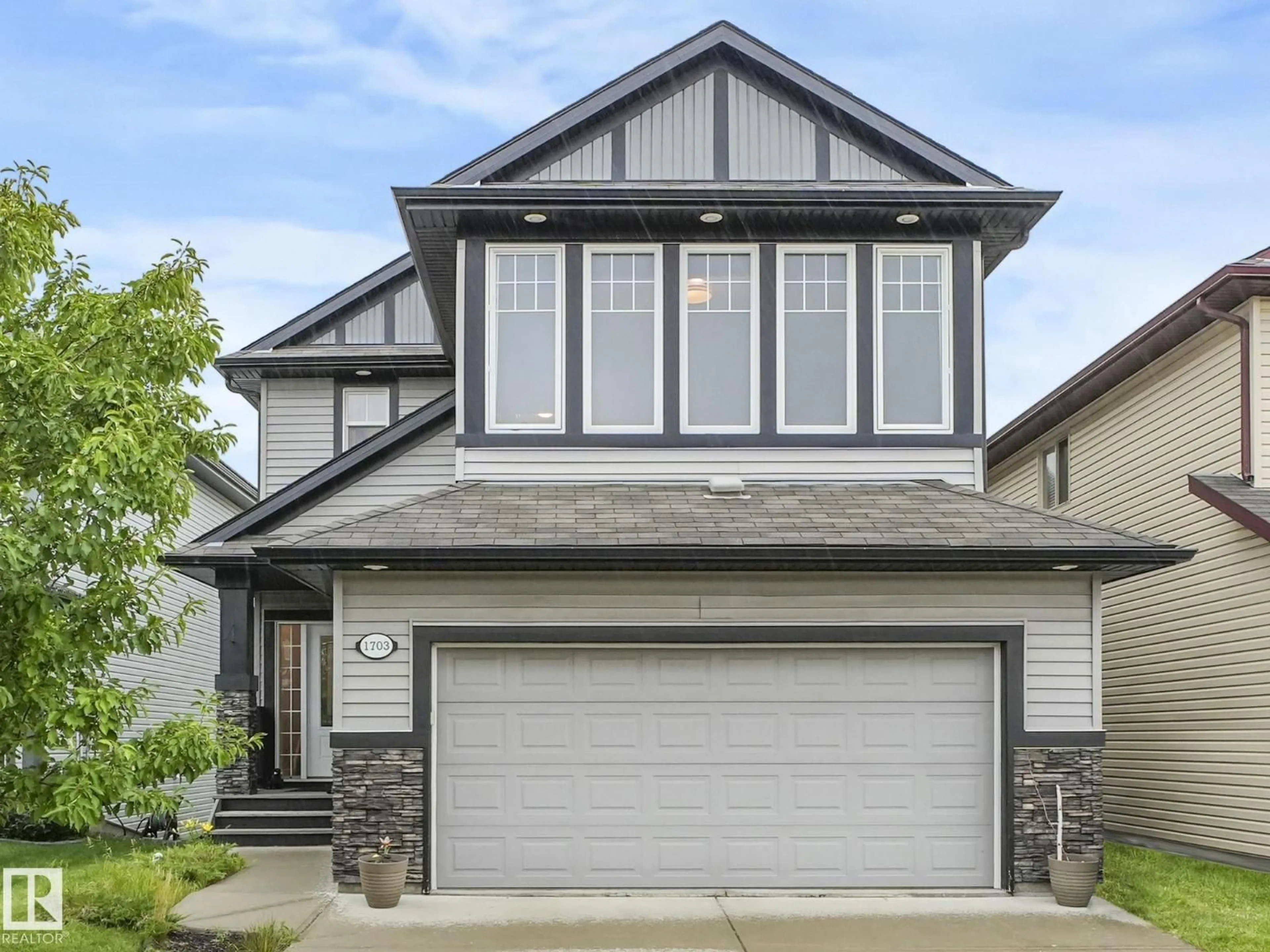 Home with vinyl exterior material, street for NW - 1703 33B ST, Edmonton Alberta T6T0P2